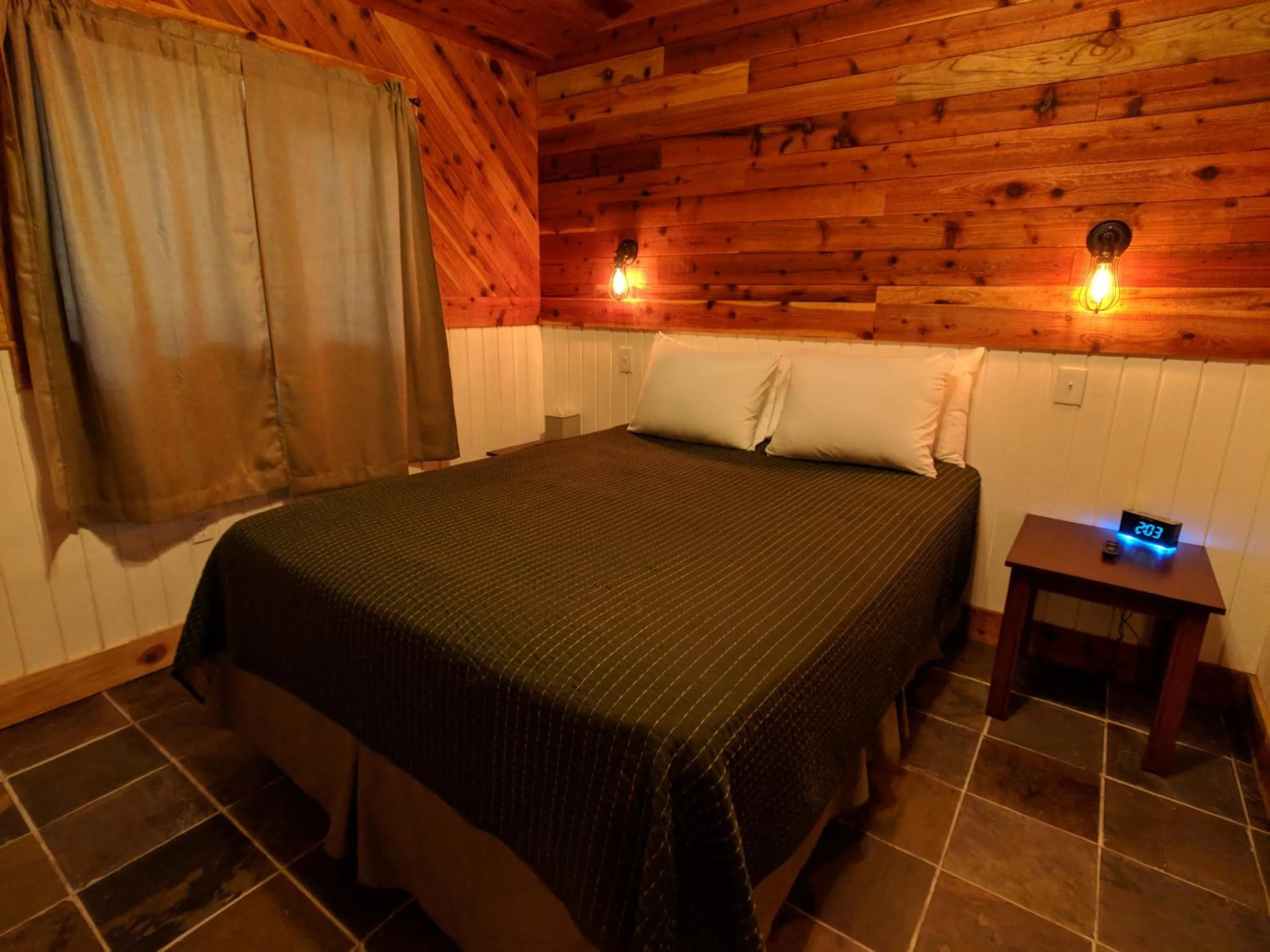 Bed in Emerald Forest Cabins