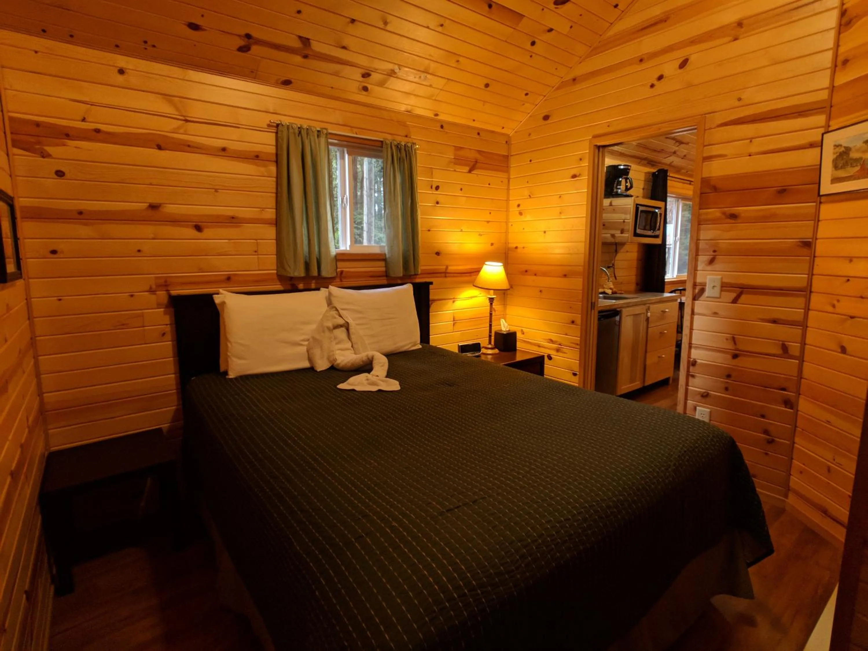 Bed in Emerald Forest Cabins