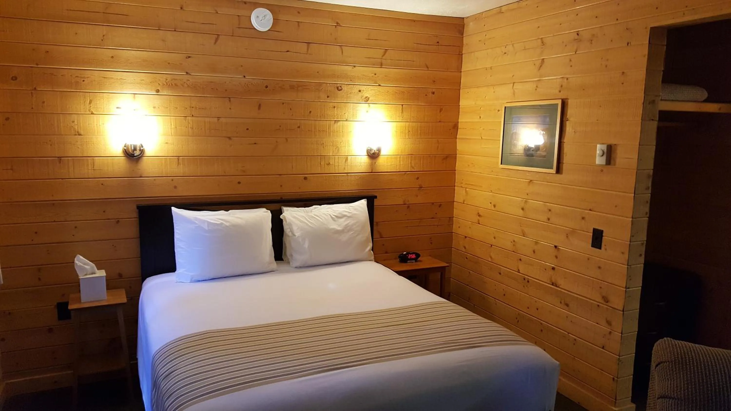 Bed in Emerald Forest Cabins