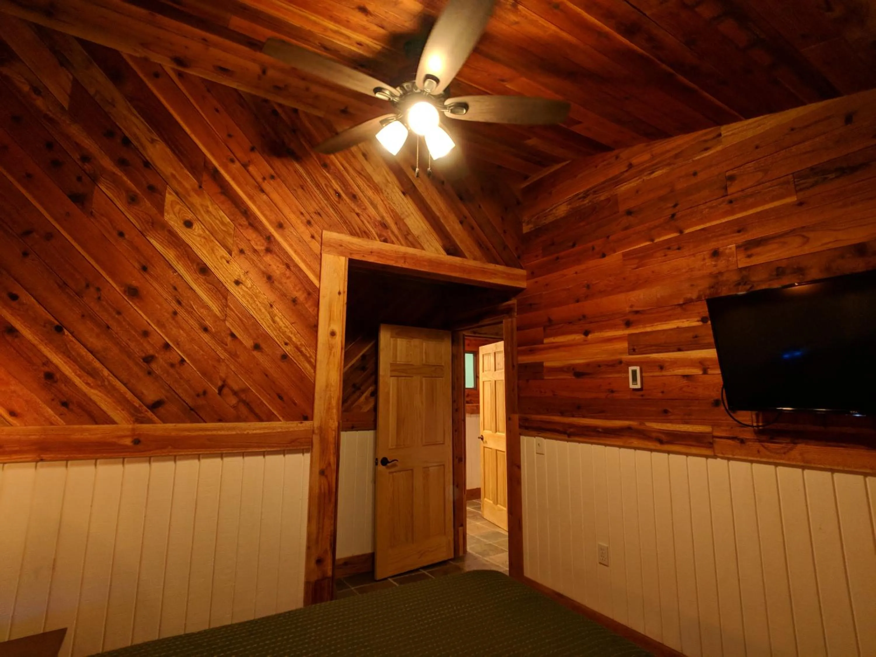 Bed in Emerald Forest Cabins