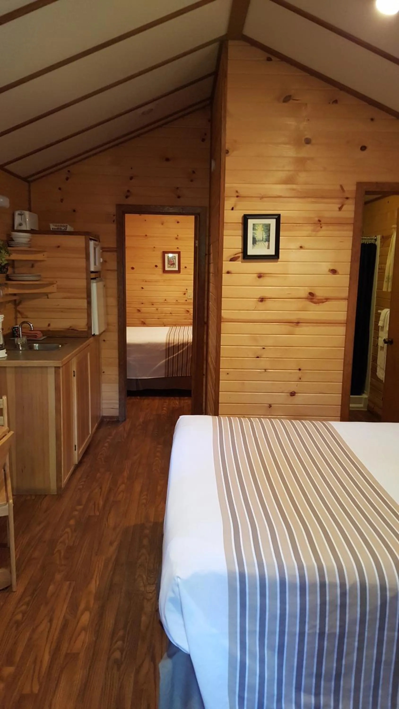 Bed in Emerald Forest Cabins