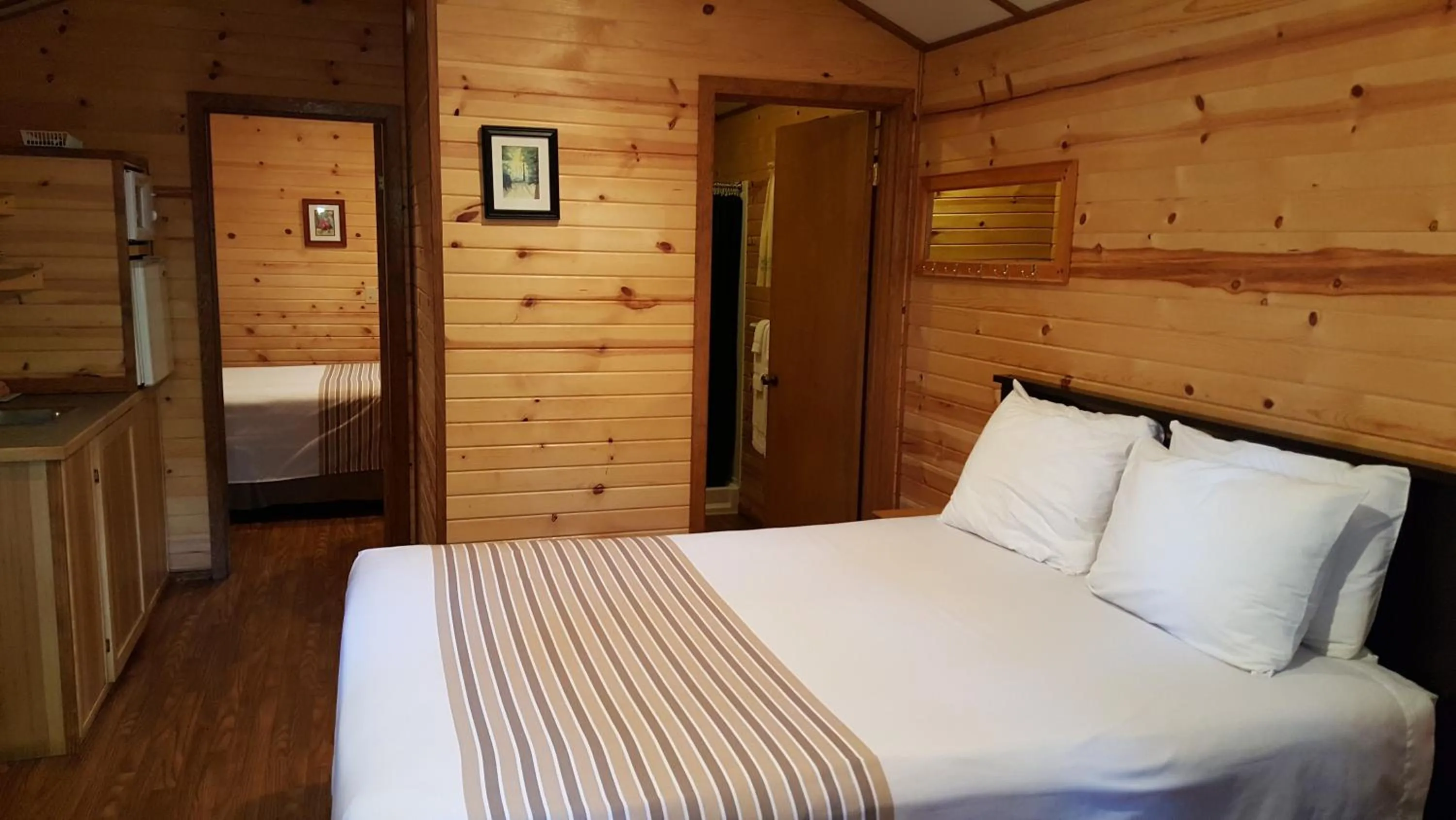 Bed in Emerald Forest Cabins