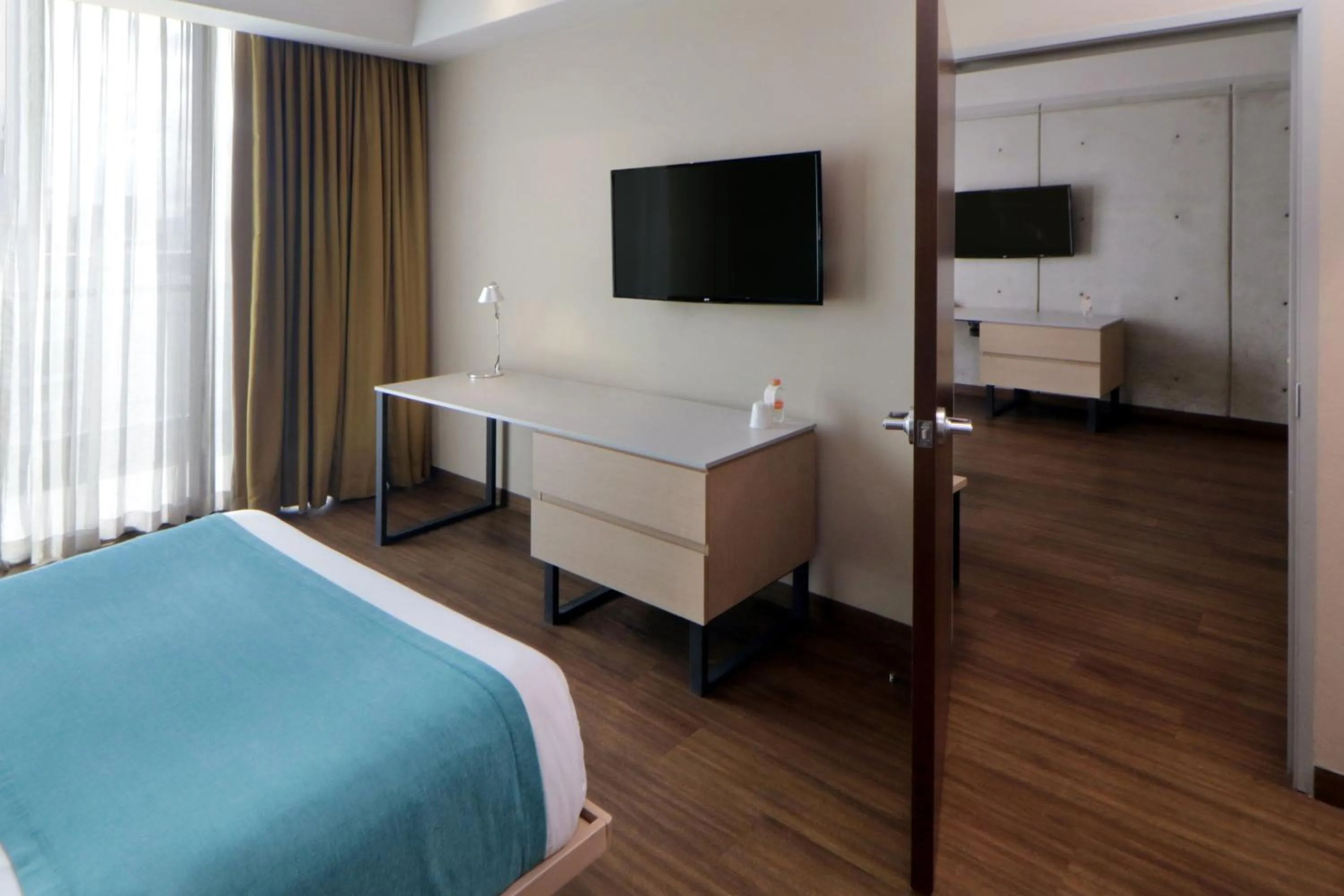 Bedroom, Bed in City Express Suites by Marriott Tijuana Rio