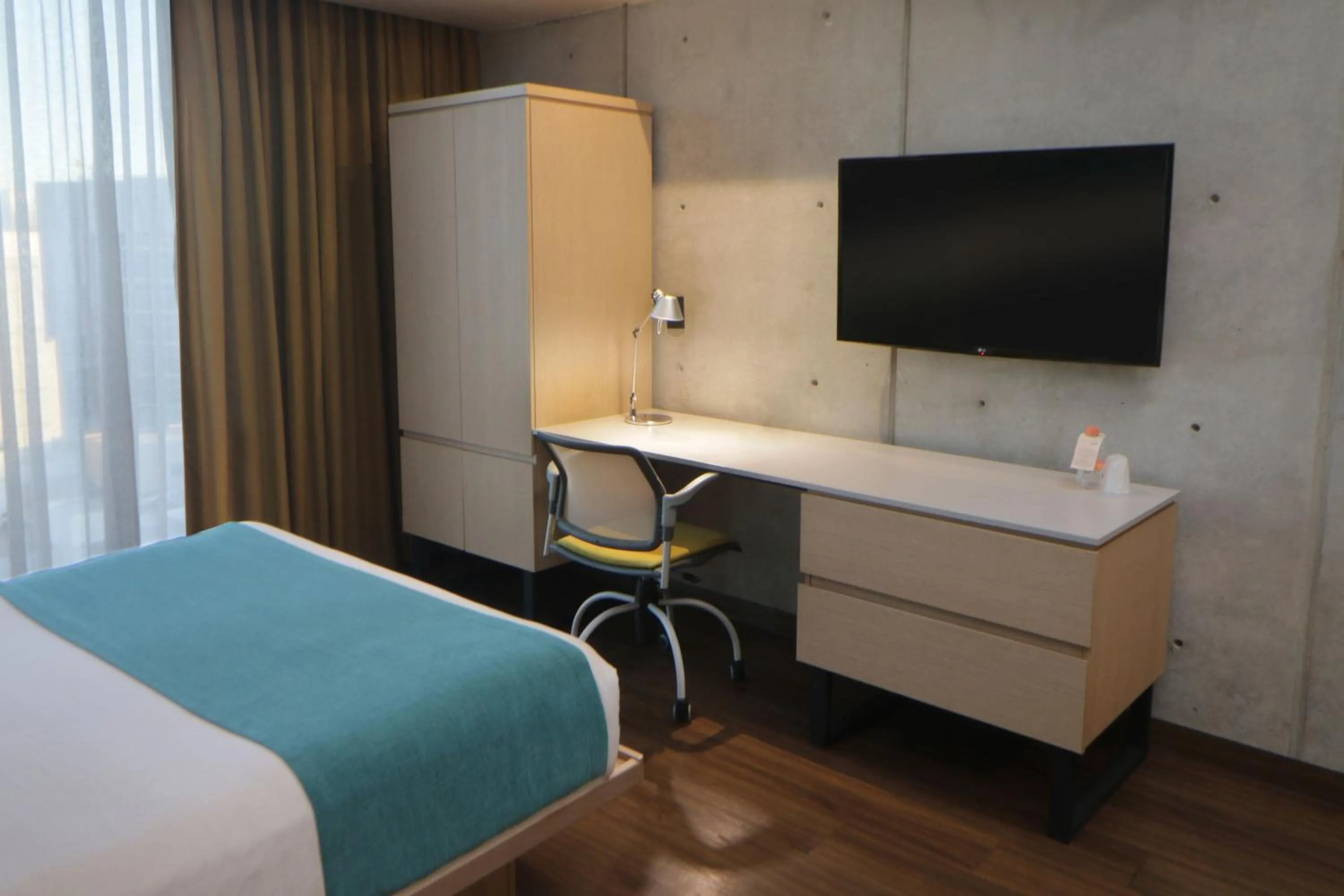Bedroom, Bed in City Express Suites by Marriott Tijuana Rio