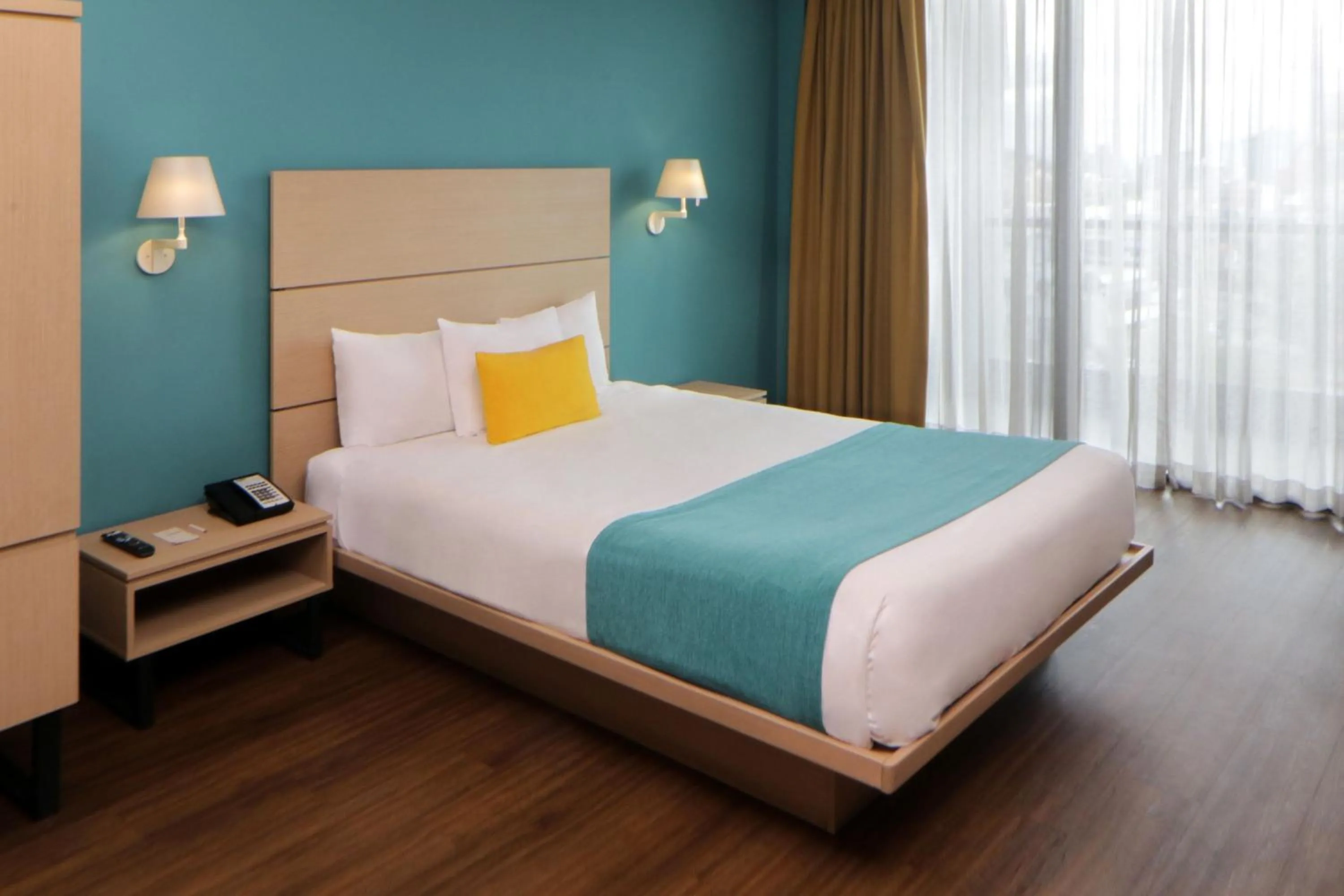 Bedroom, Bed in City Express Suites by Marriott Tijuana Rio