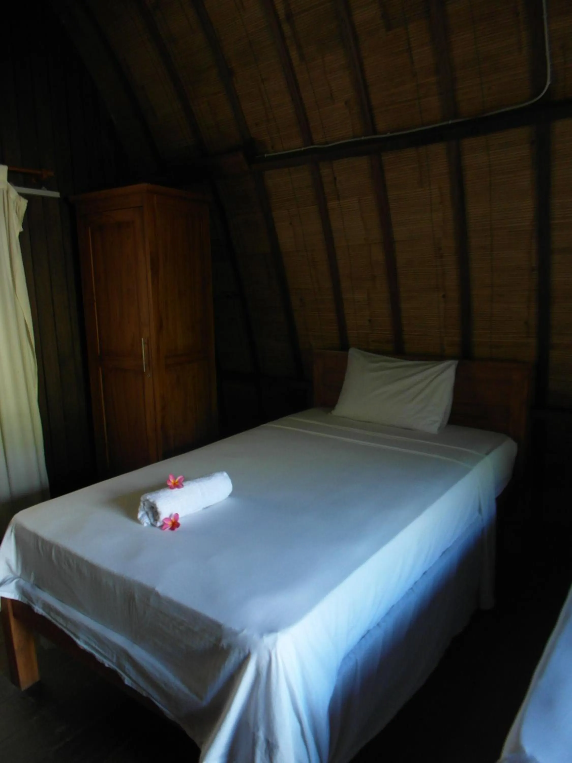 Decorative detail, Bed in Melati Cottage