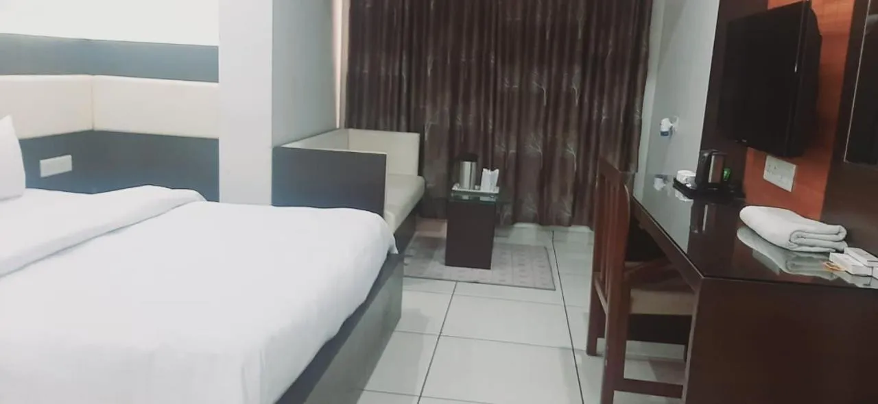 Bed in Hotel Apex Inn