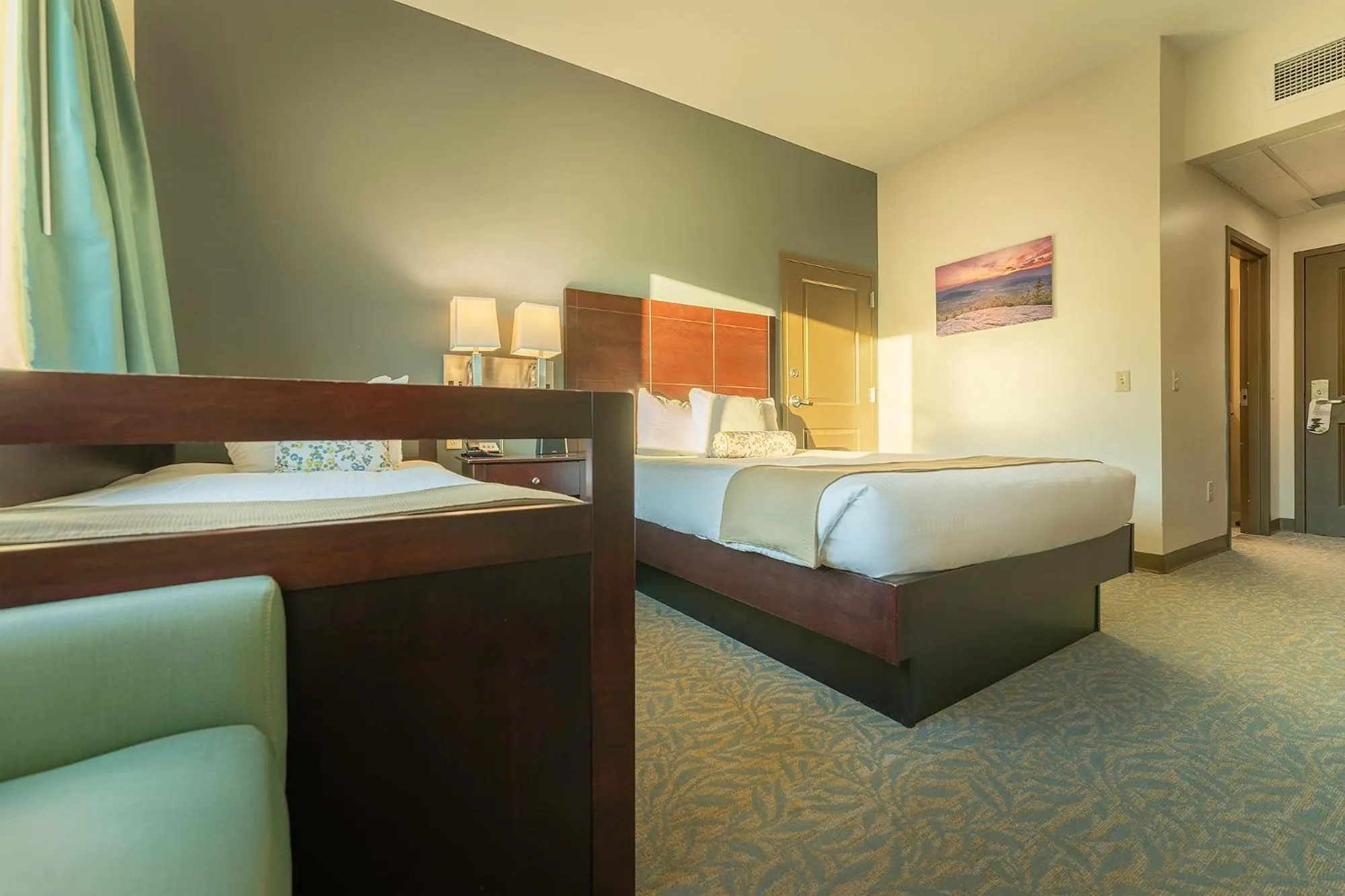 Bed in Sun & Ski Inn and Suites