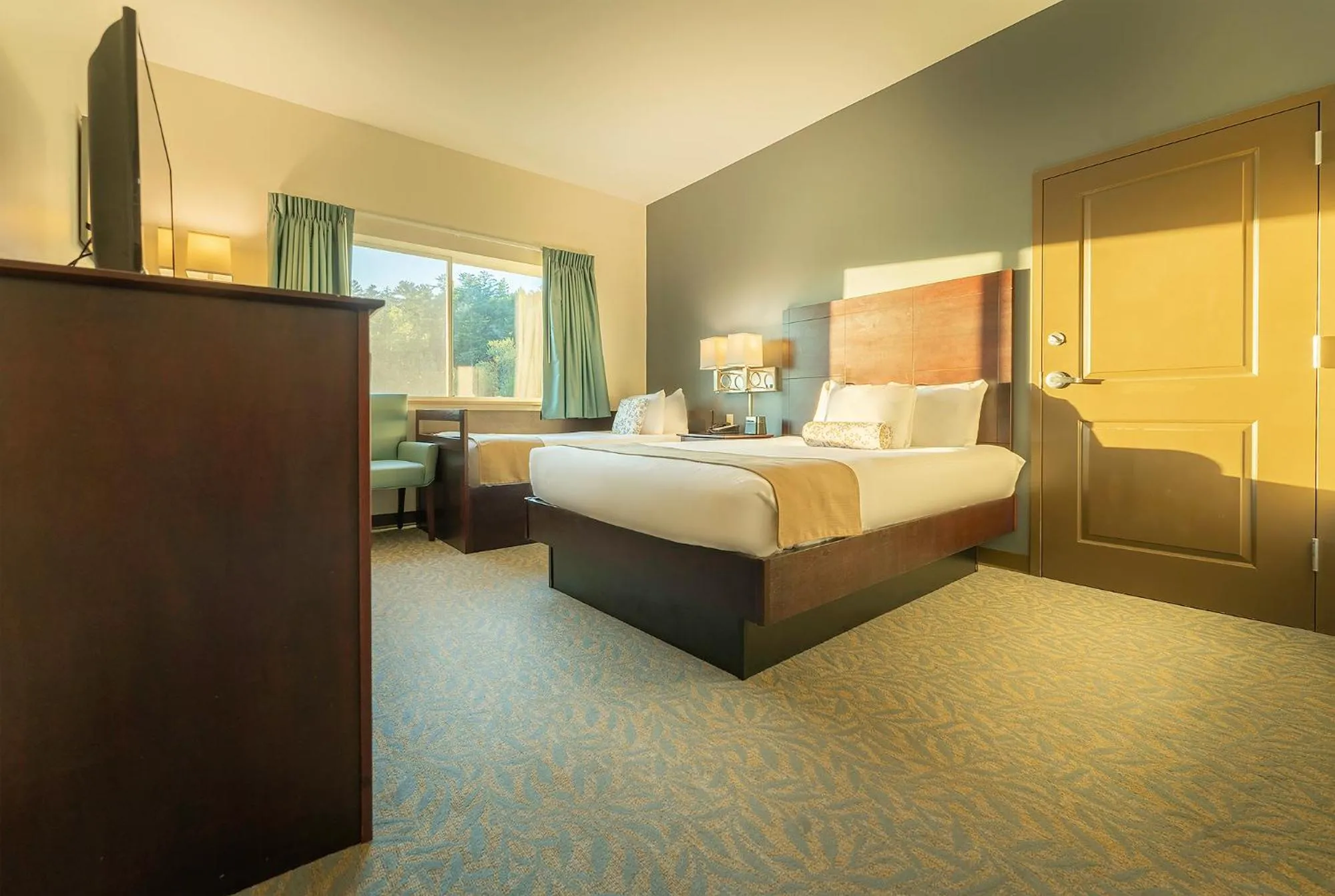 Bed in Sun & Ski Inn and Suites