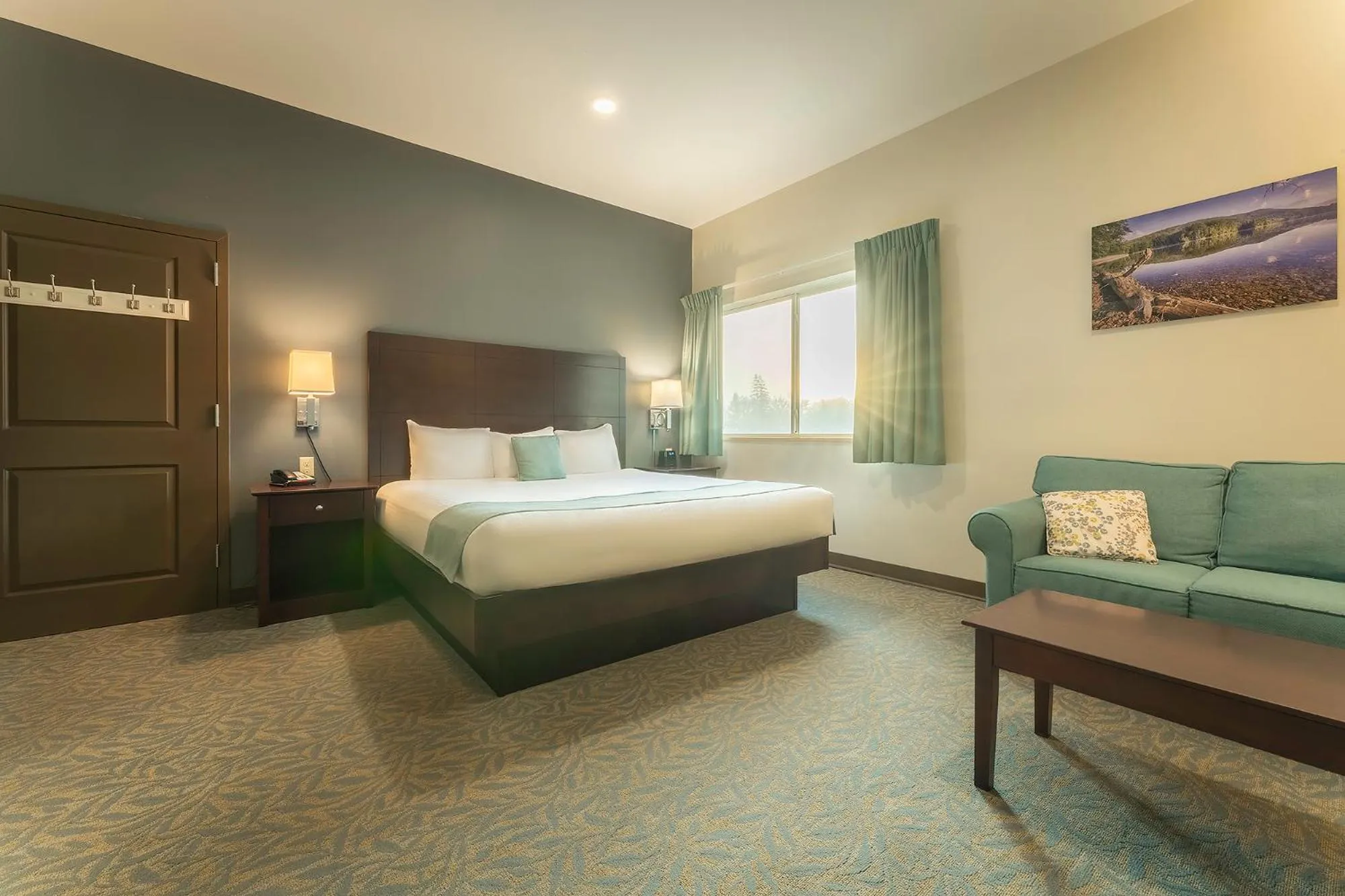 Bed in Sun & Ski Inn and Suites