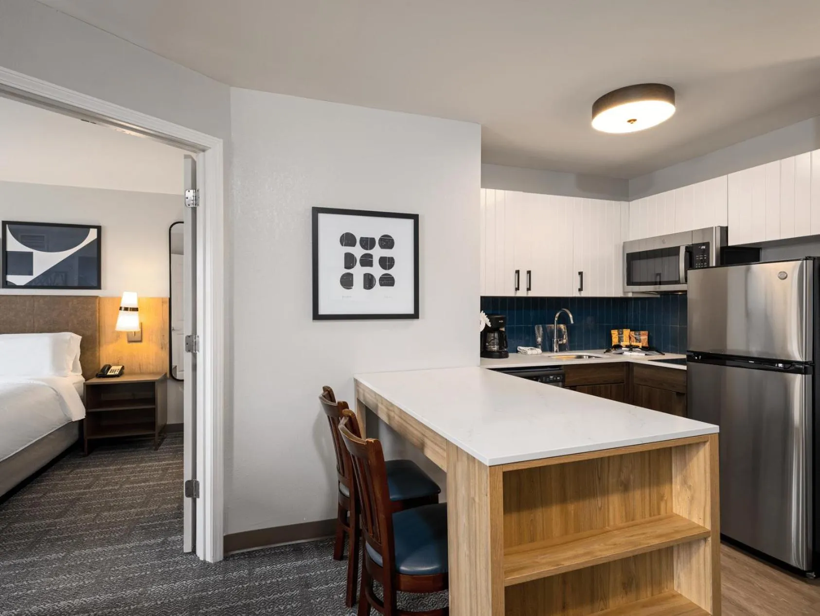 Kitchen or kitchenette, Bed in Staybridge Suites Rochester University by IHG