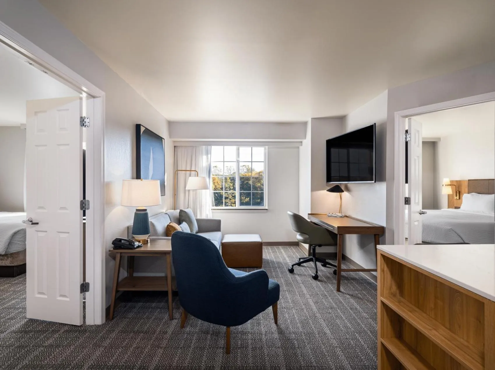 Living room, Bed in Staybridge Suites Rochester University by IHG