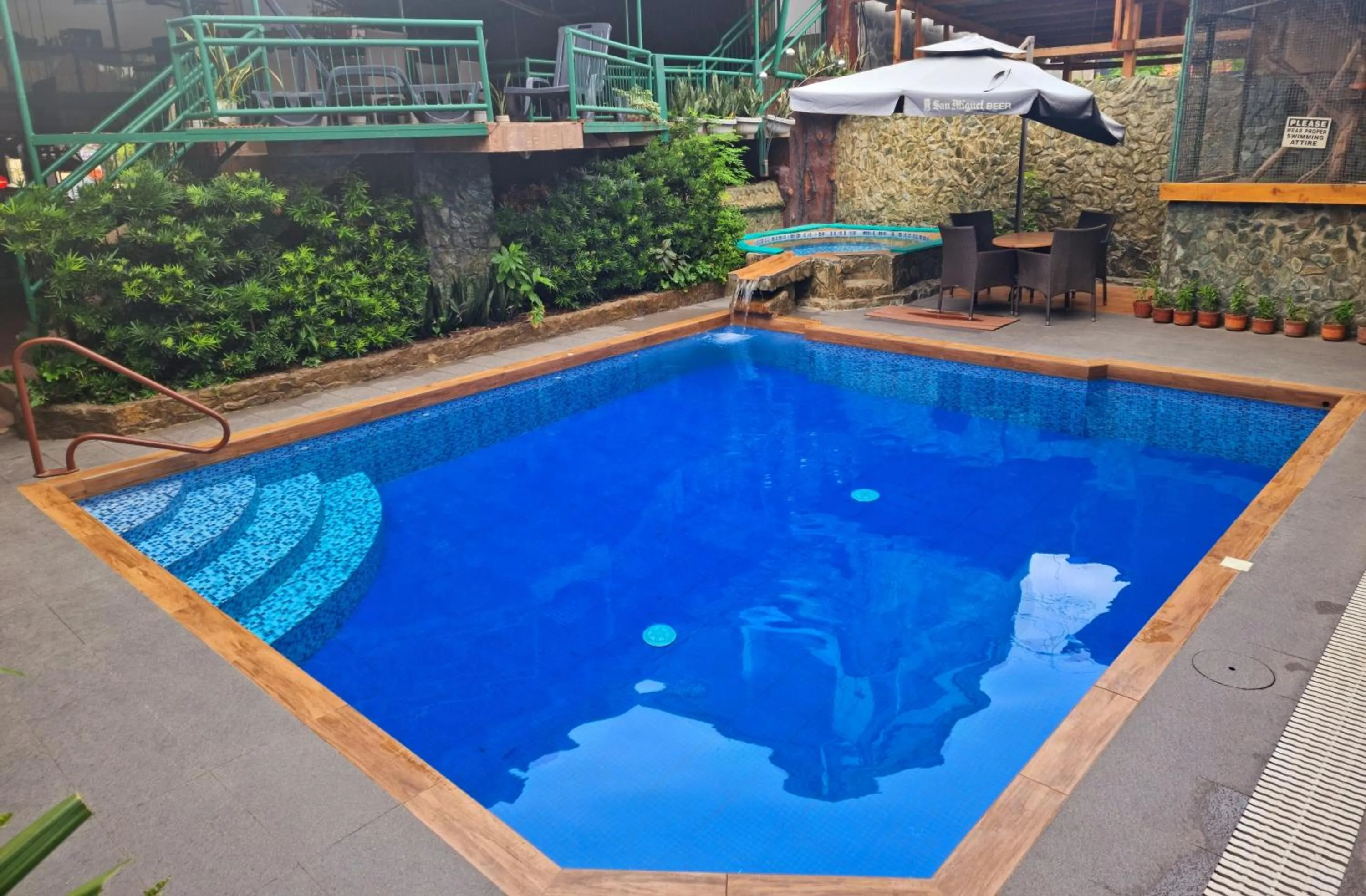 Swimming pool in MB's Garden Inn