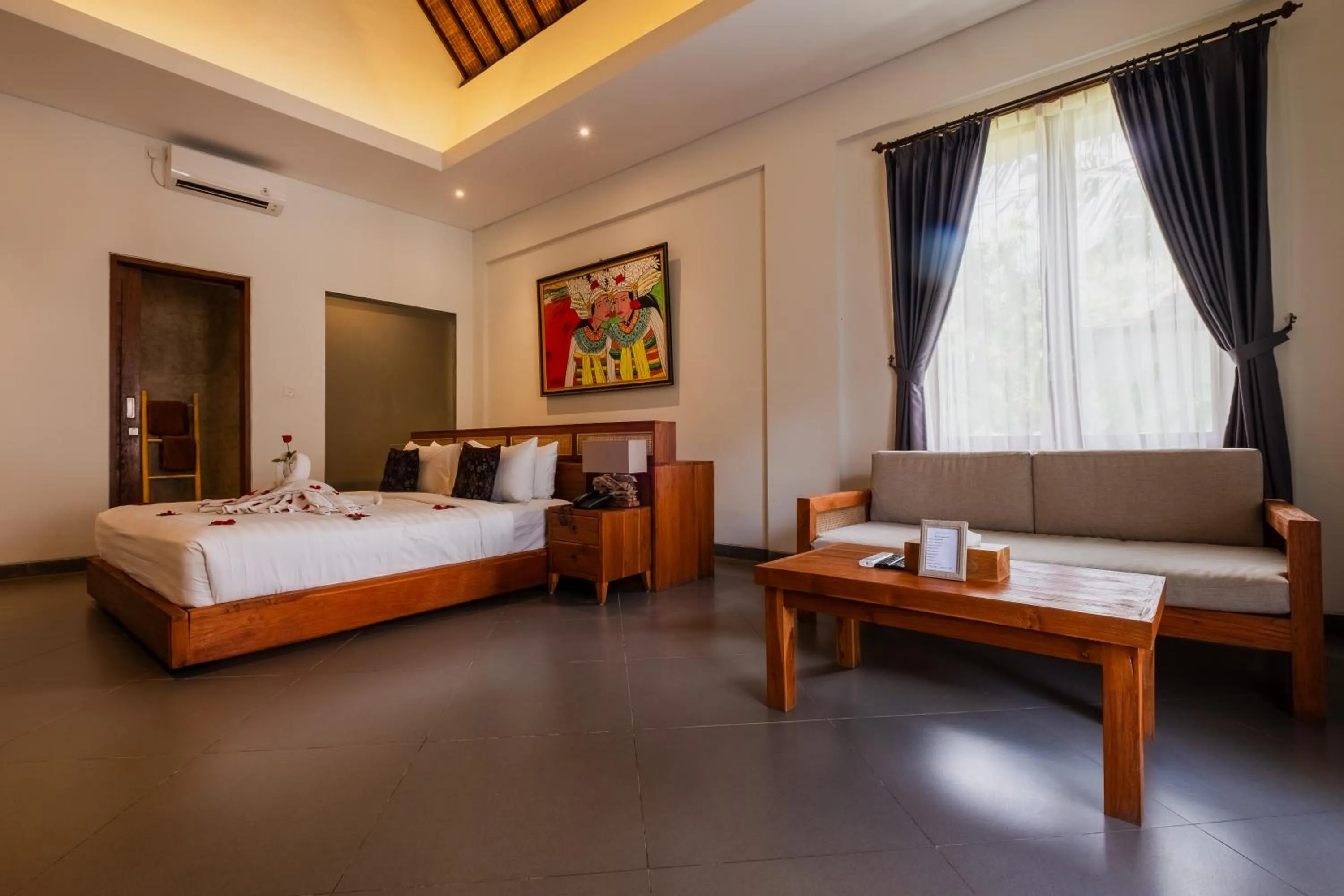 Living room, Bed in Alamdini Resort Ubud