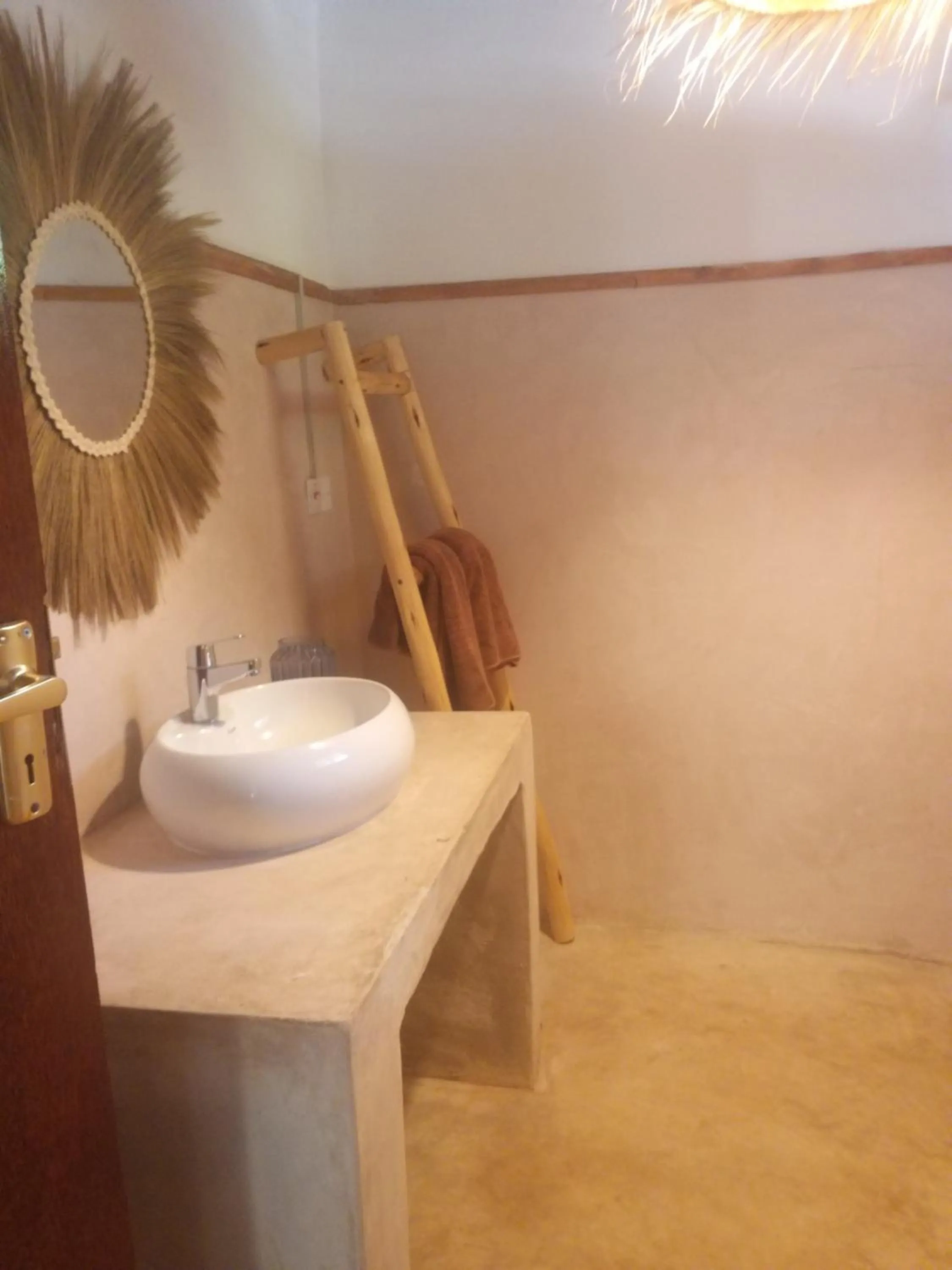 Bathroom in Mpole Bungalows