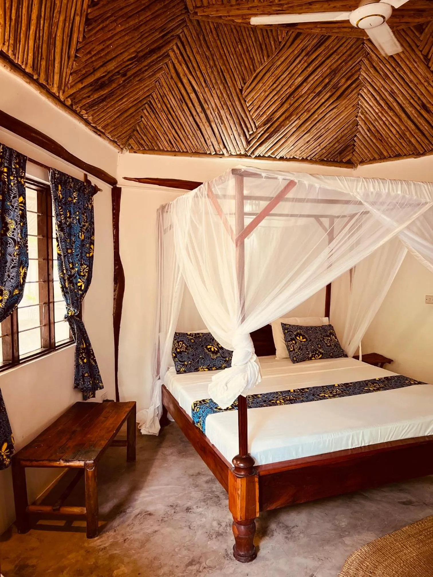 Bed in Mpole Bungalows