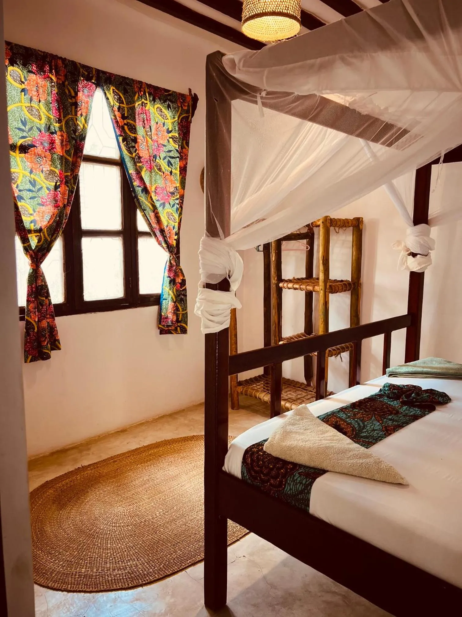 Bed in Mpole Bungalows