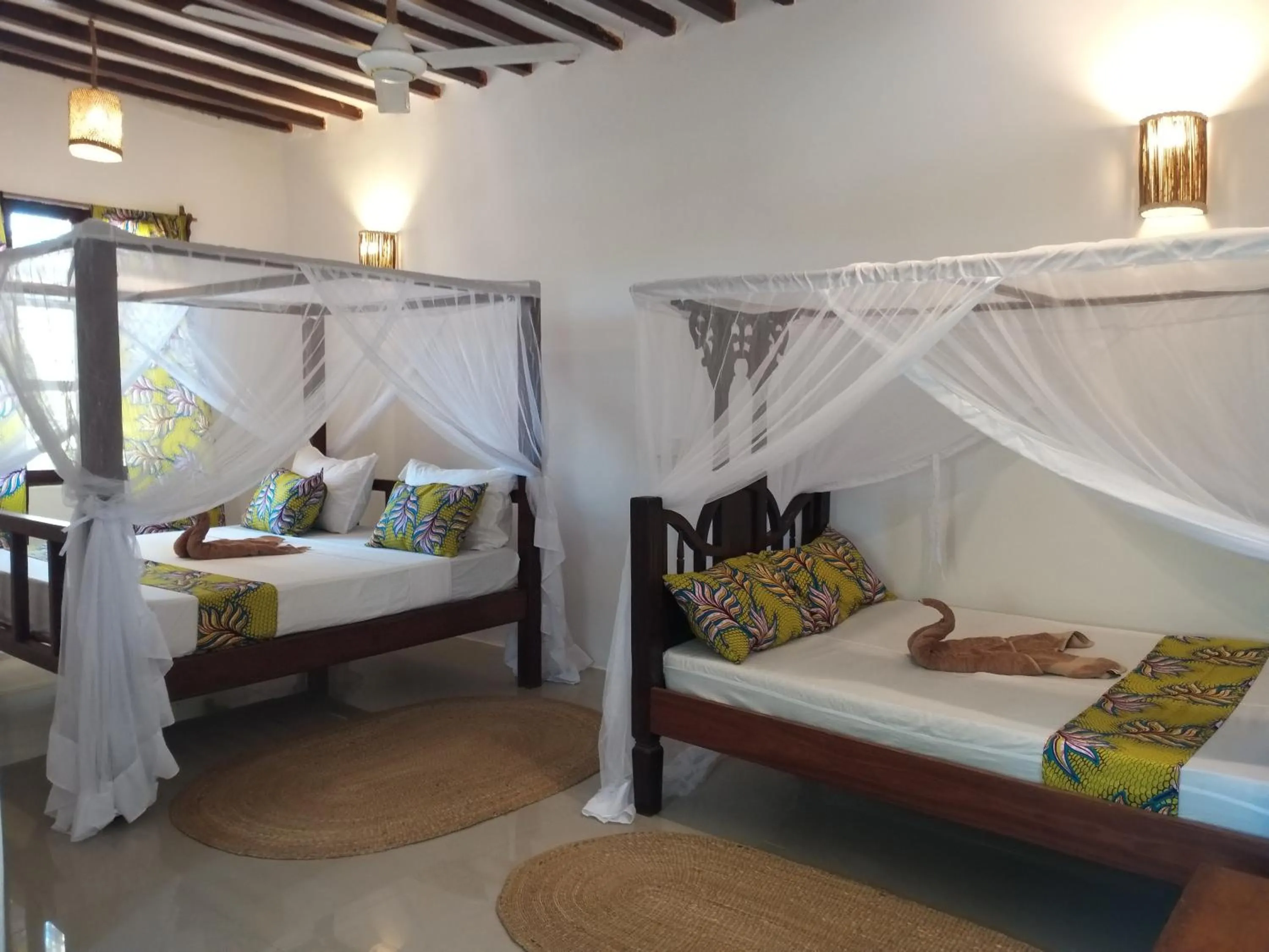 Bed in Mpole Bungalows