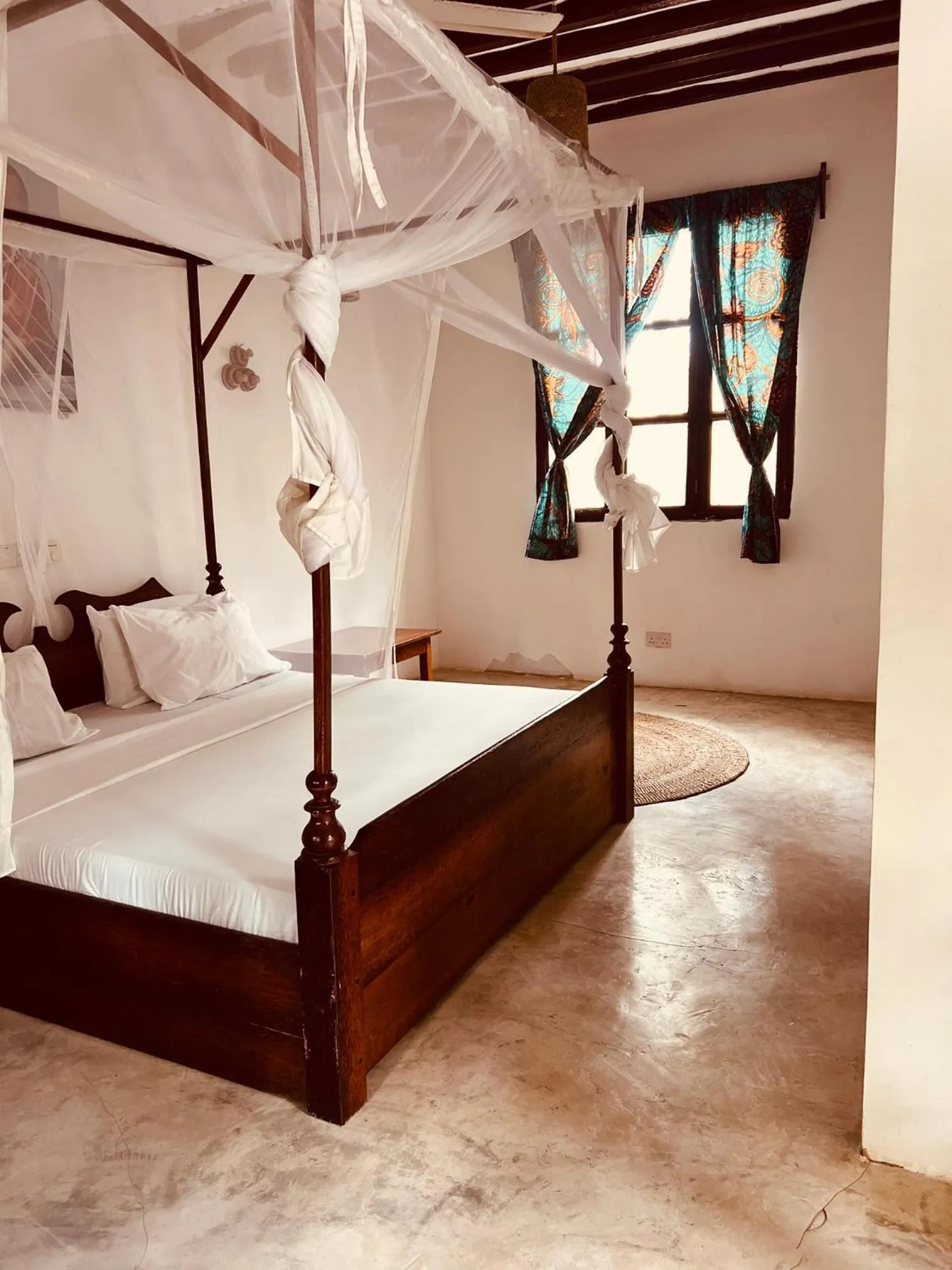 Bed in Mpole Bungalows