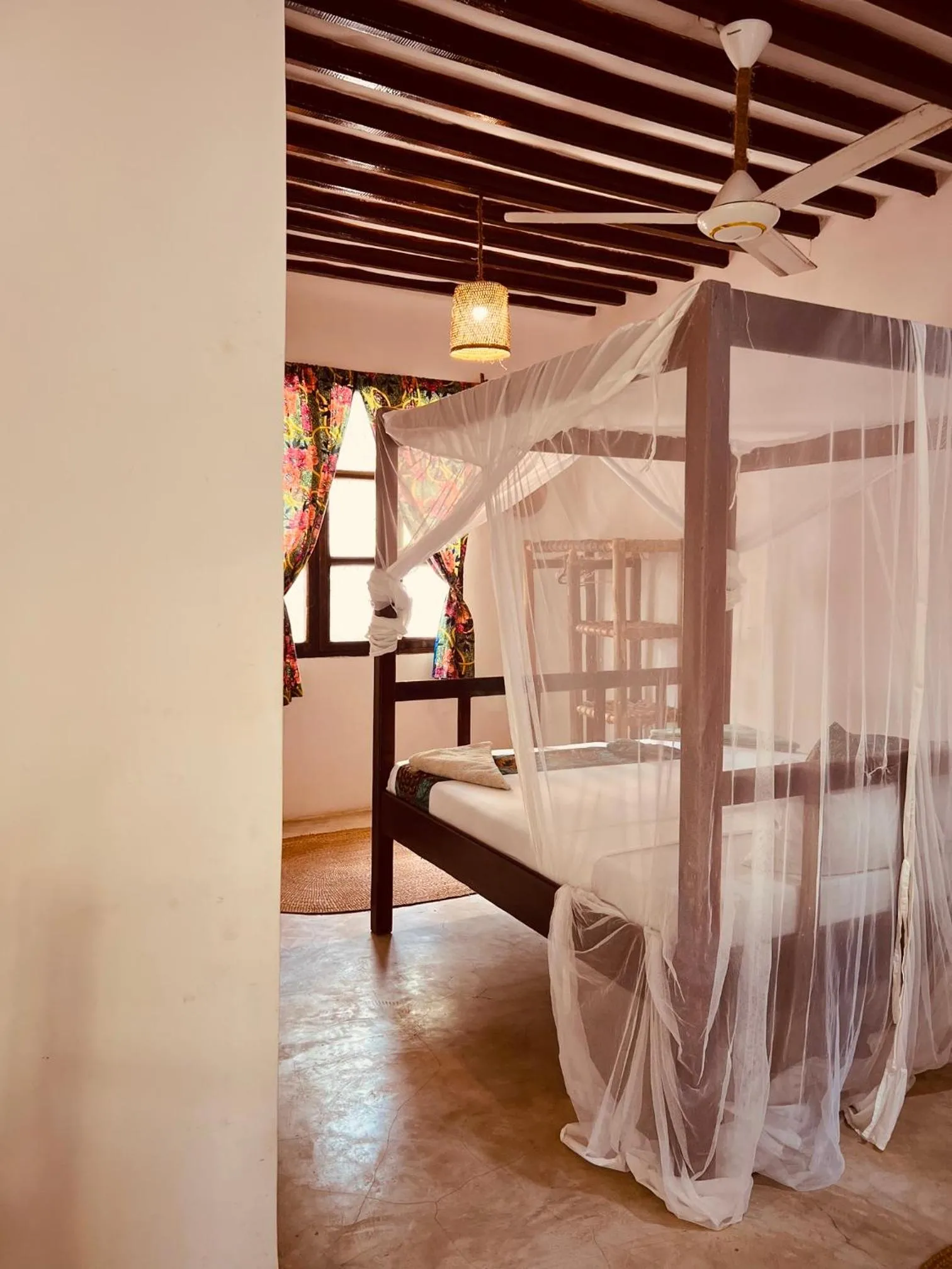 Bed in Mpole Bungalows