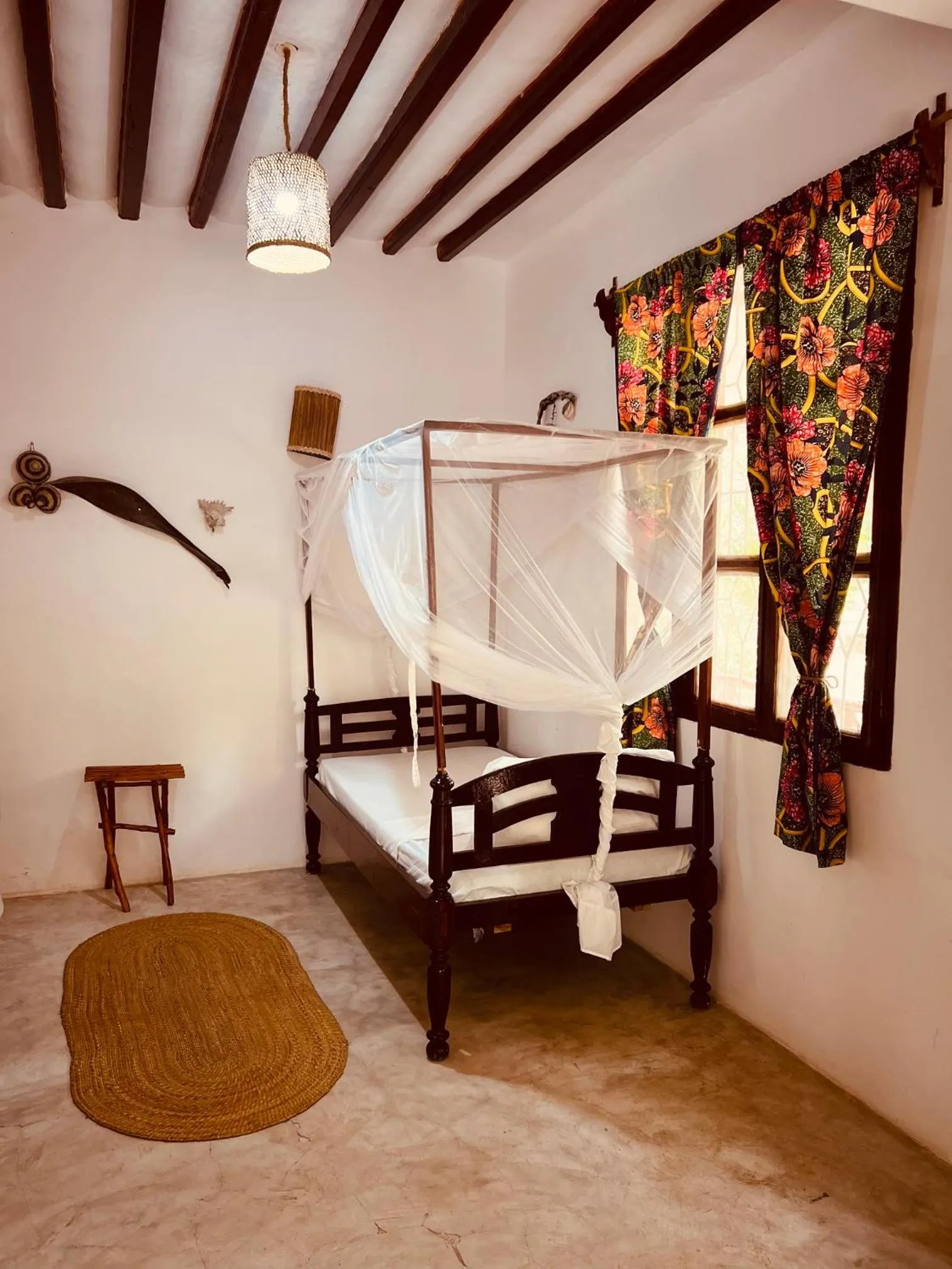 Bed in Mpole Bungalows