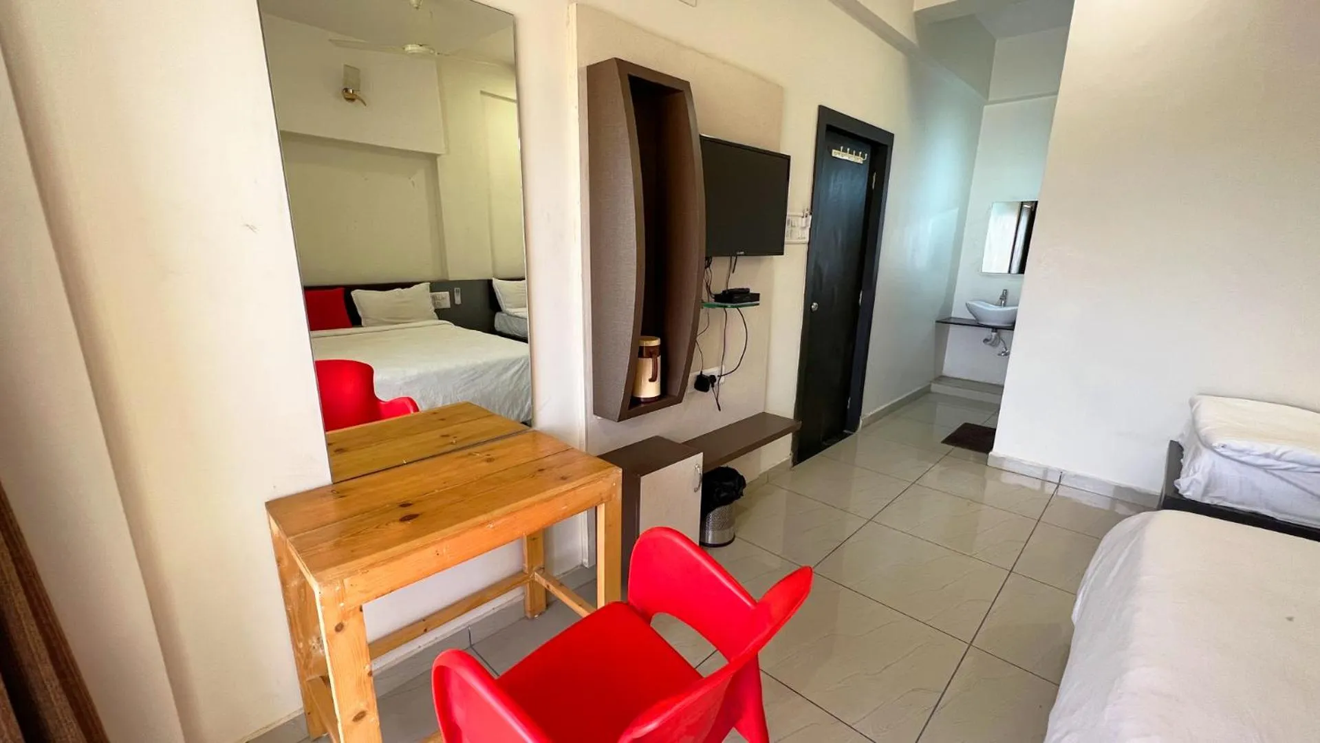 Seating area, Bed in The Gir Harmony Hotel