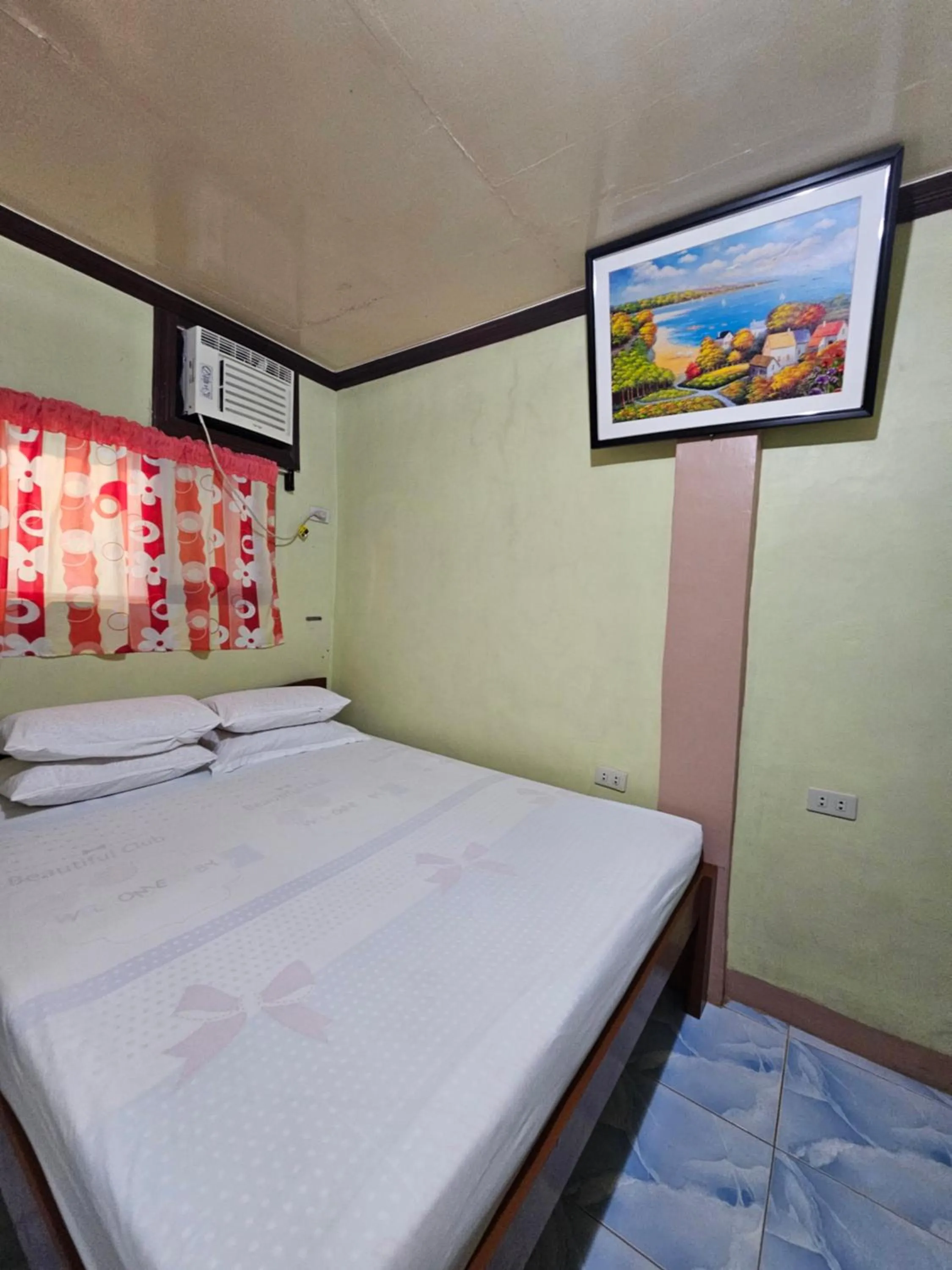 Bed in Bohol Sea Breeze Cottages and Resort