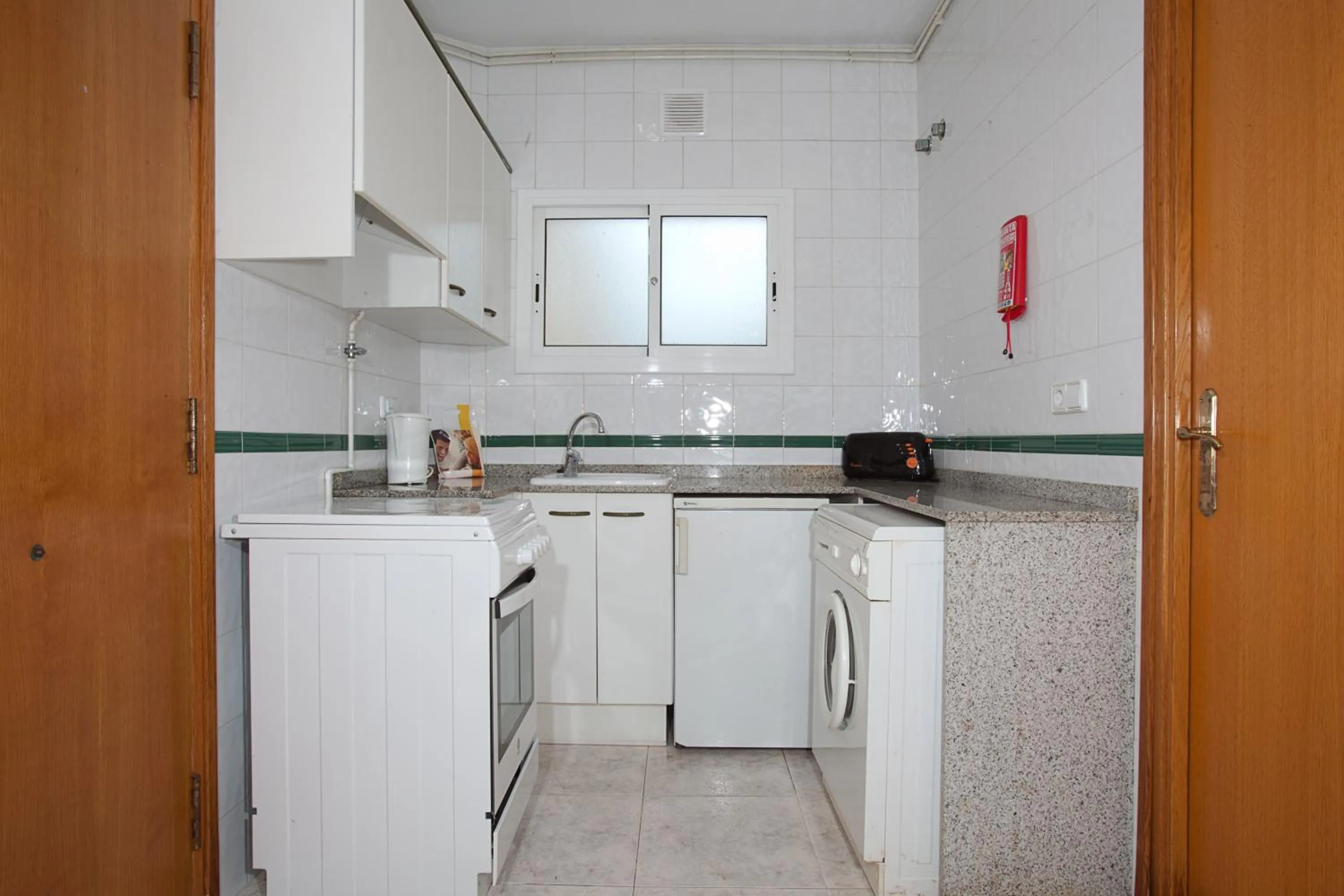 Kitchen or kitchenette in Apartamentos Sunway Tara