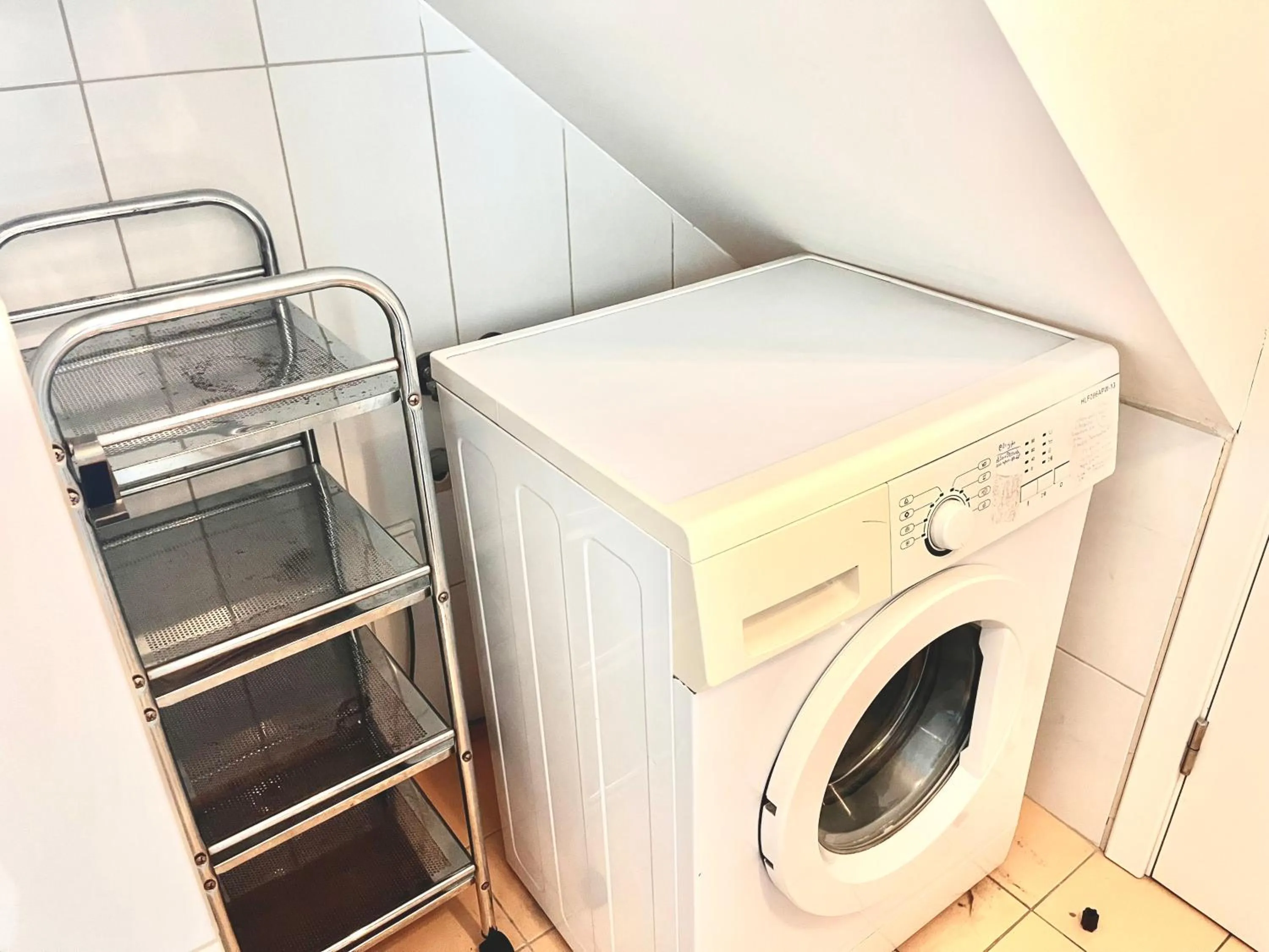 washing machine in Elvita Apartments