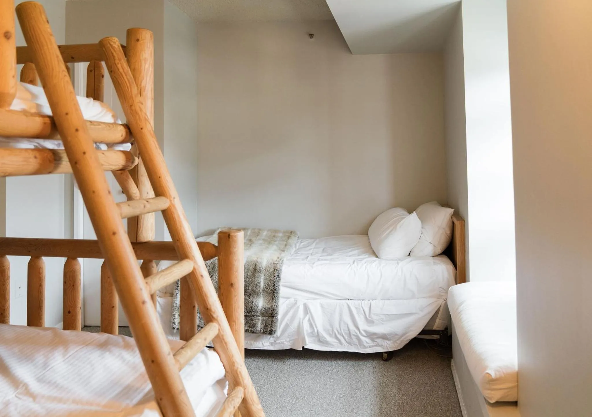 Bed in Gibbons Life Accommodations