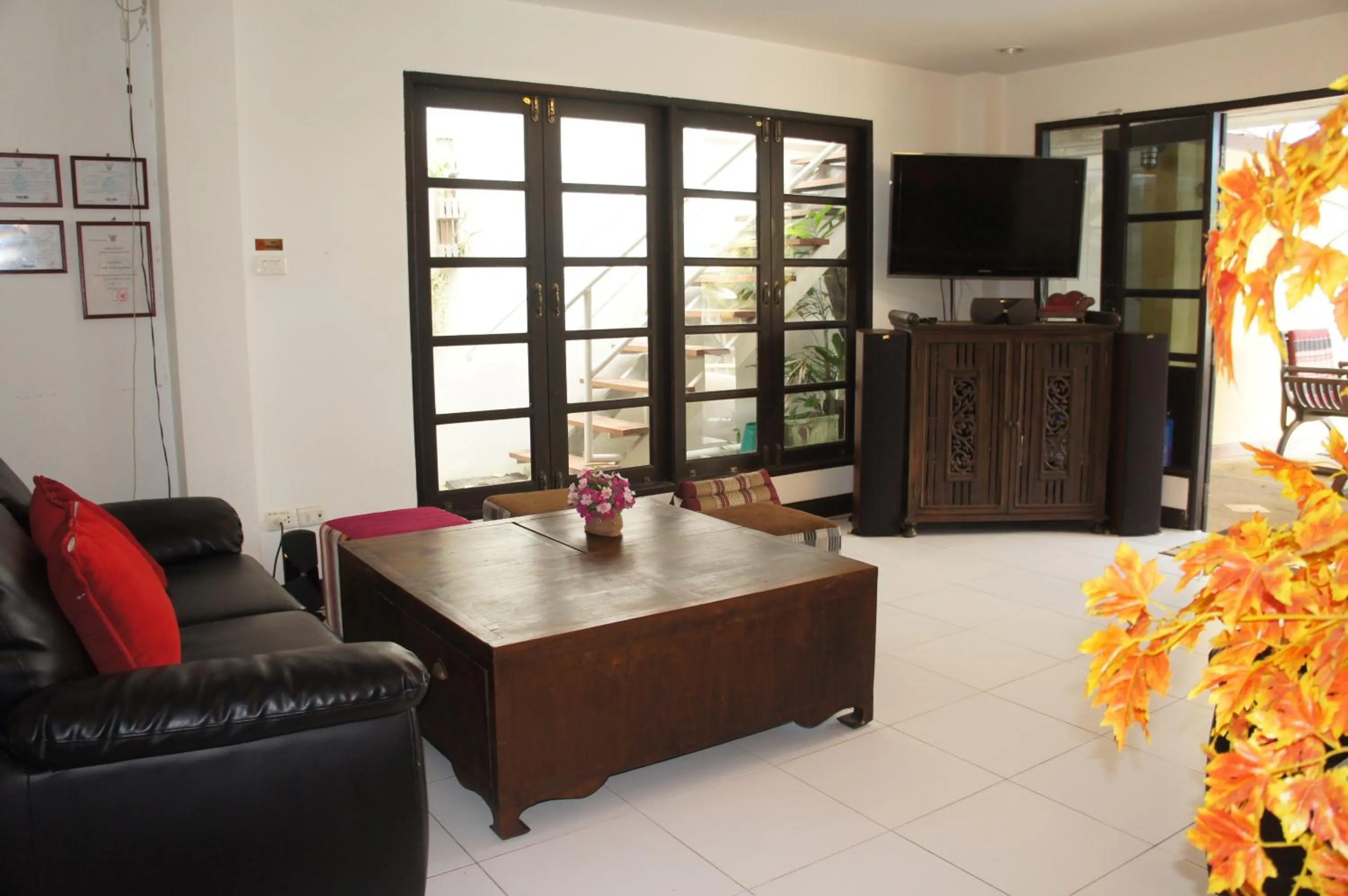 Communal lounge/ TV room in Phuket Gay Homestay