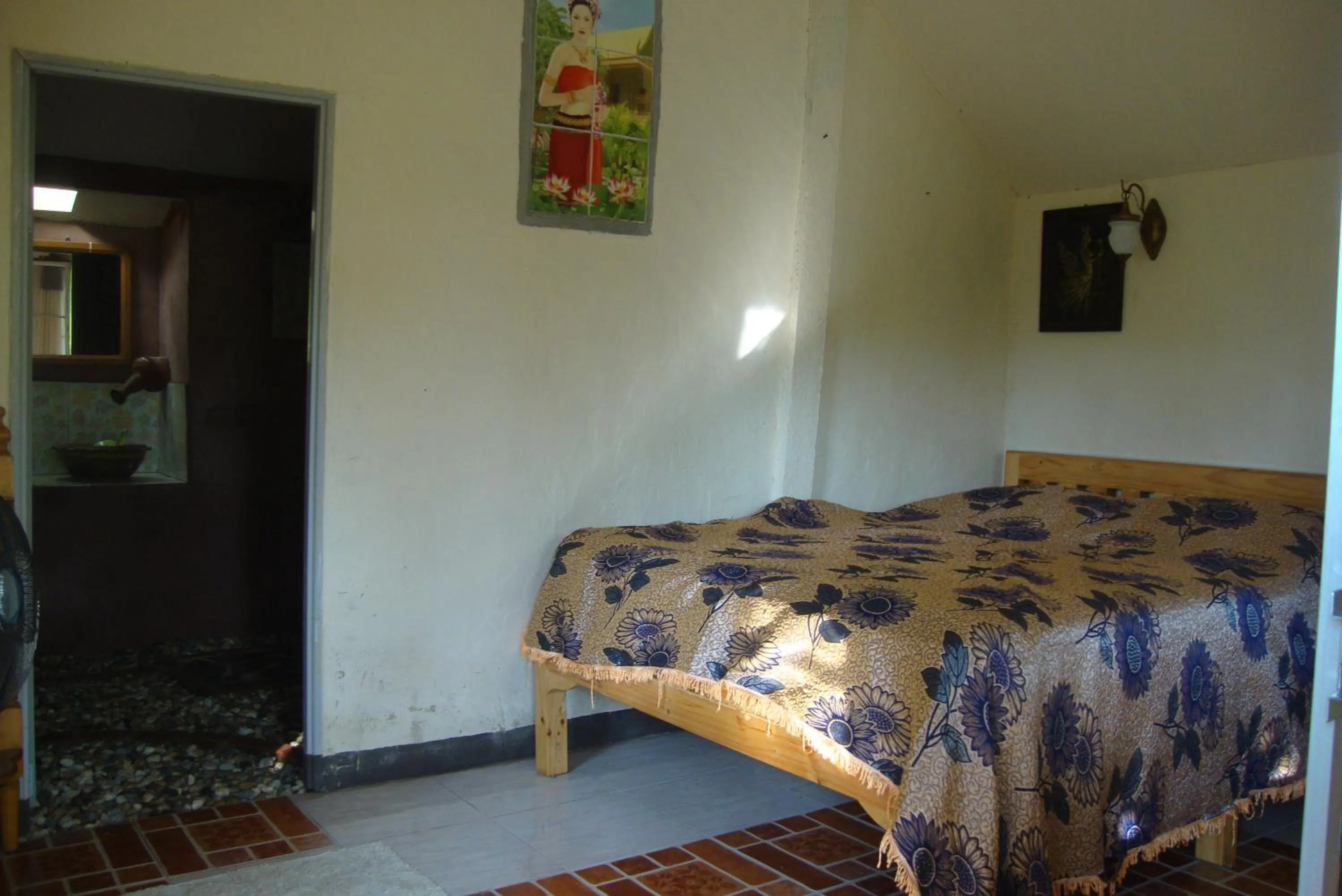 Bed in Baan Suan Jantra Home Stay