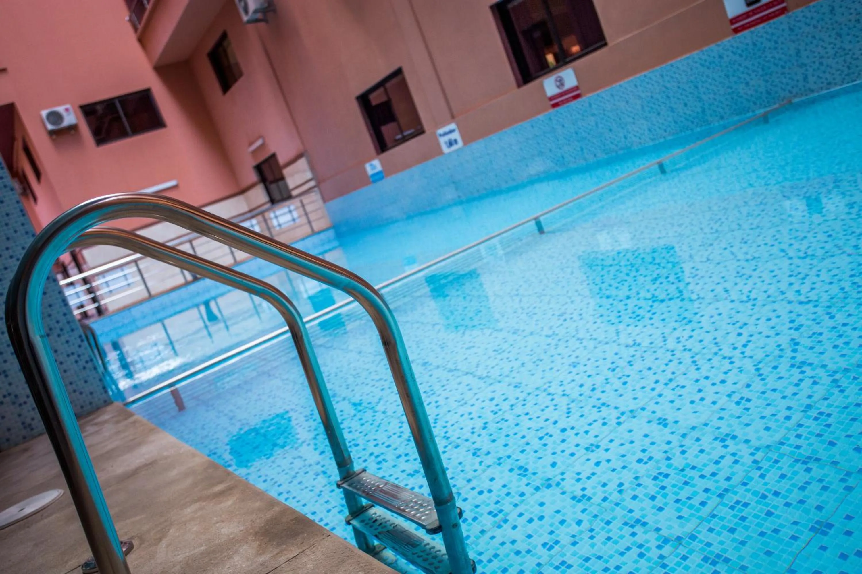 Swimming pool in Appart Hotel Les Ambassadeurs