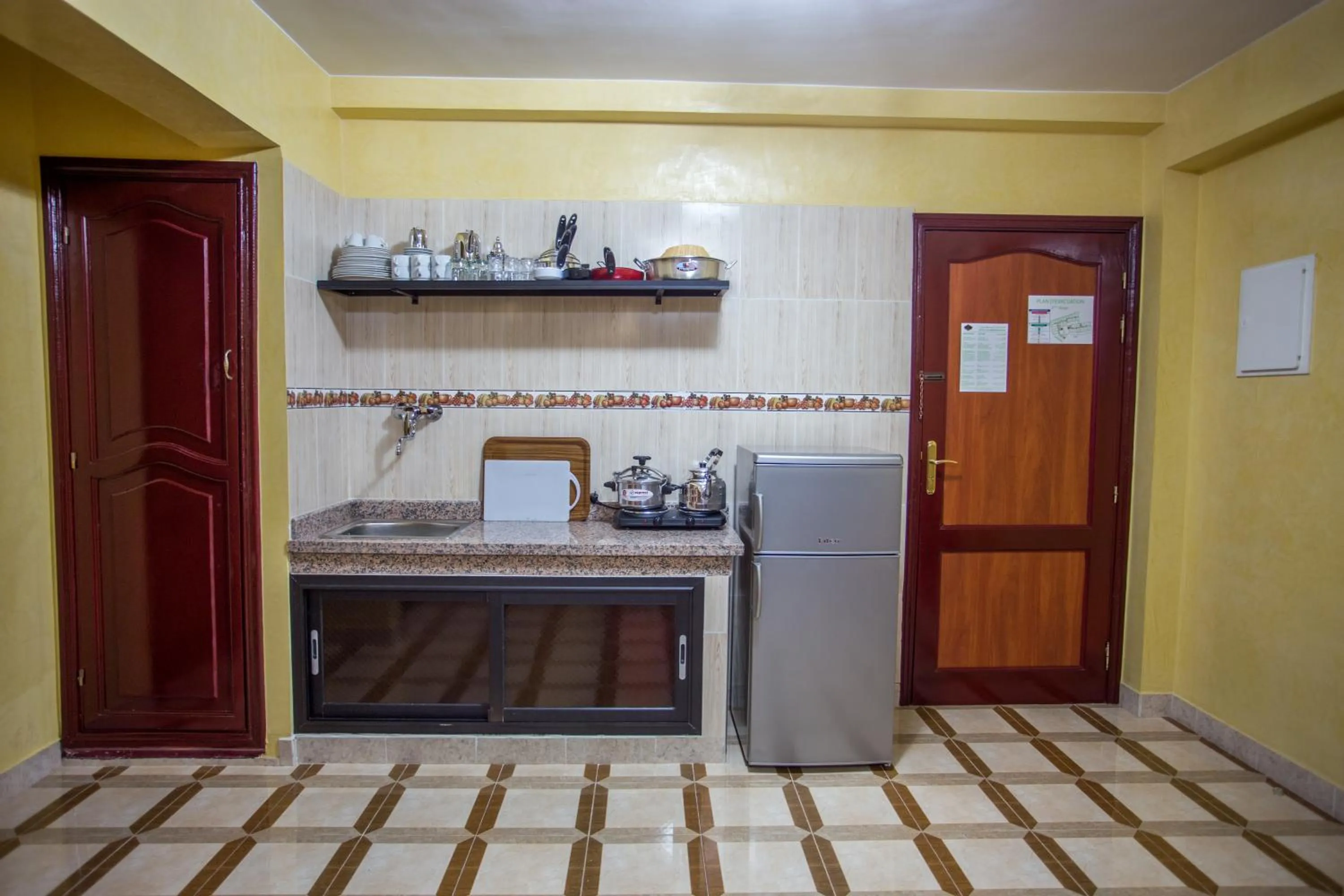 Kitchen or kitchenette in Appart Hotel Les Ambassadeurs