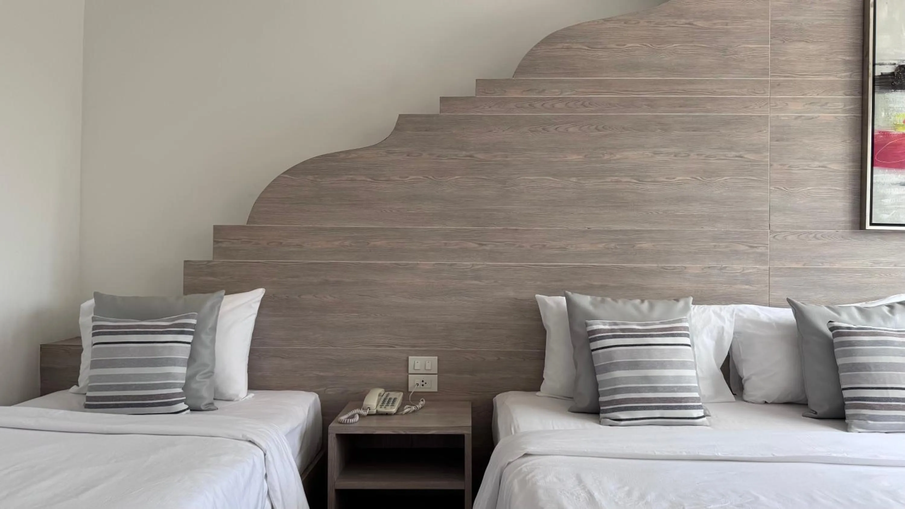 Bed in Methavalai Residence Hotel