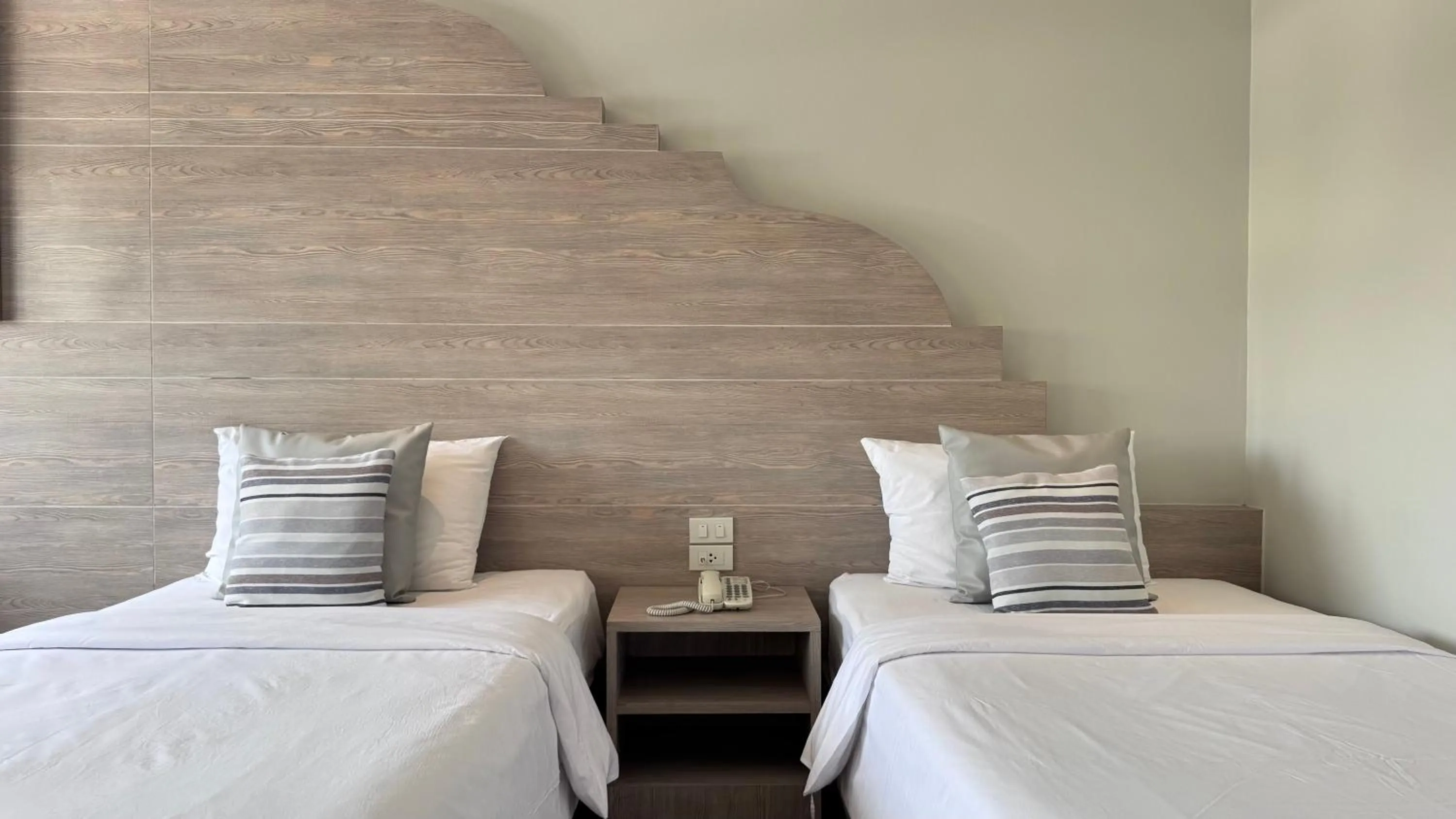 Bed in Methavalai Residence Hotel