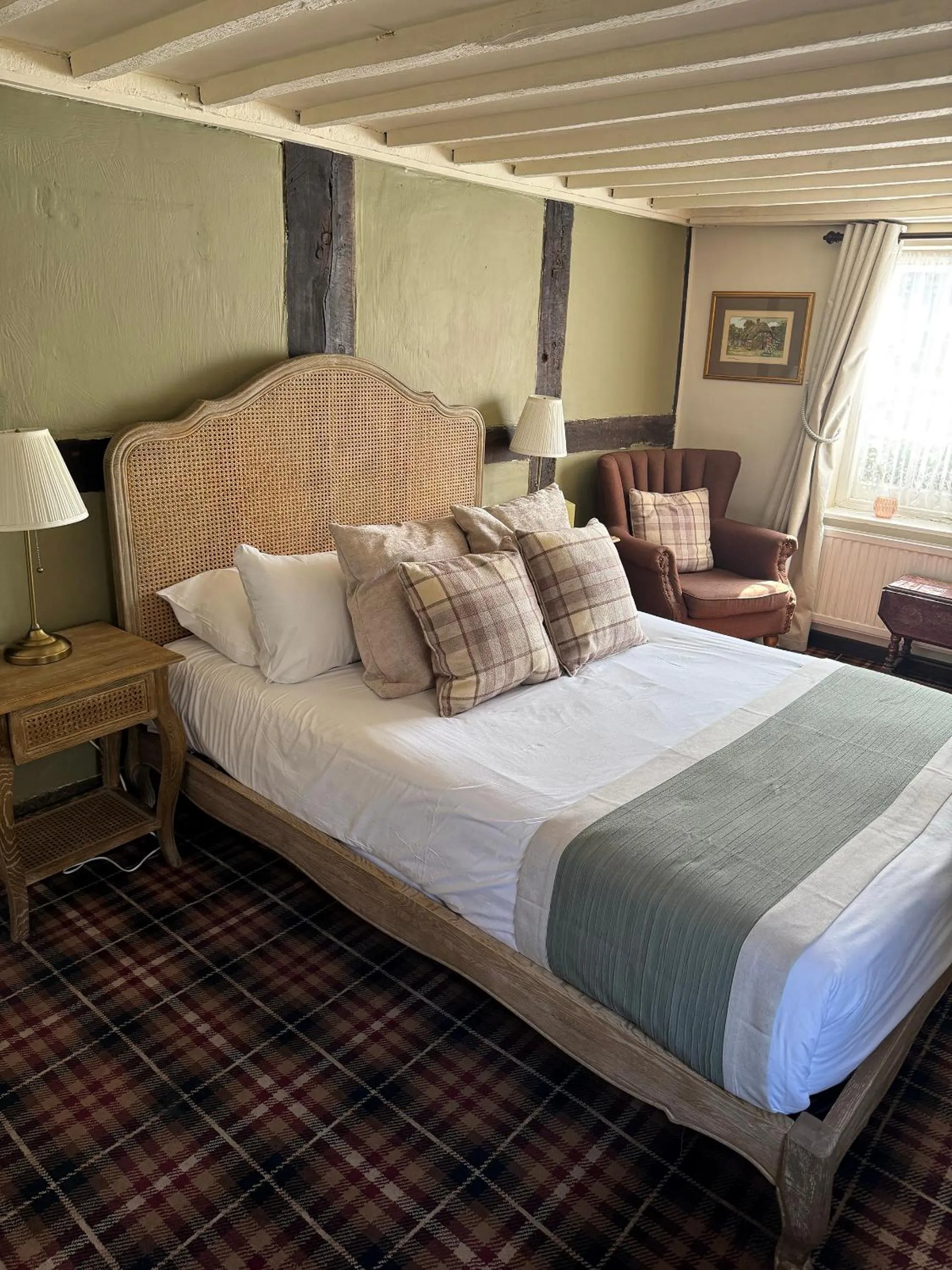 Bed in Thatched Cottage Hotel