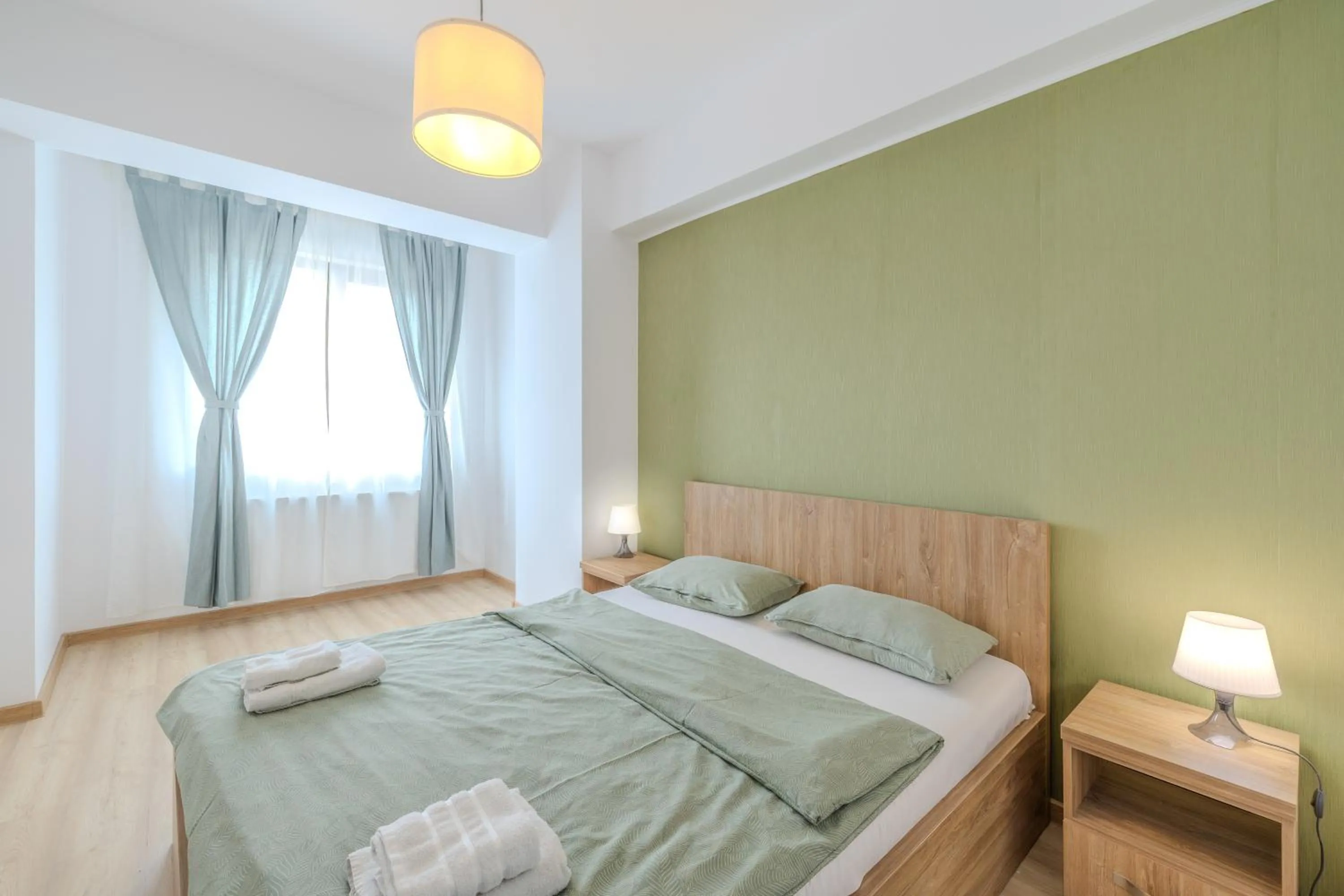Bed in Palace Central Suites