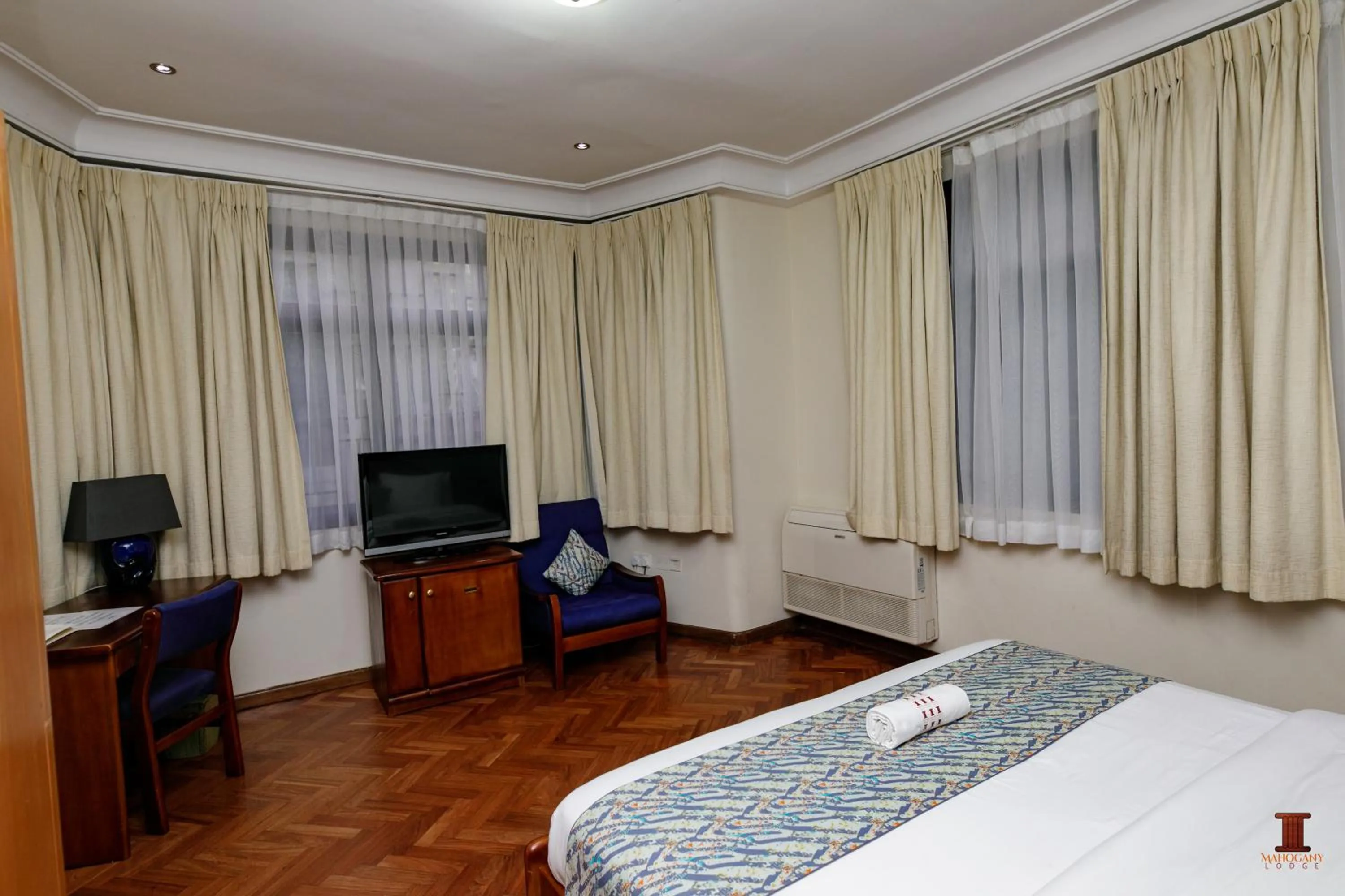 Bed in Mahogany Lodge, Cantonments