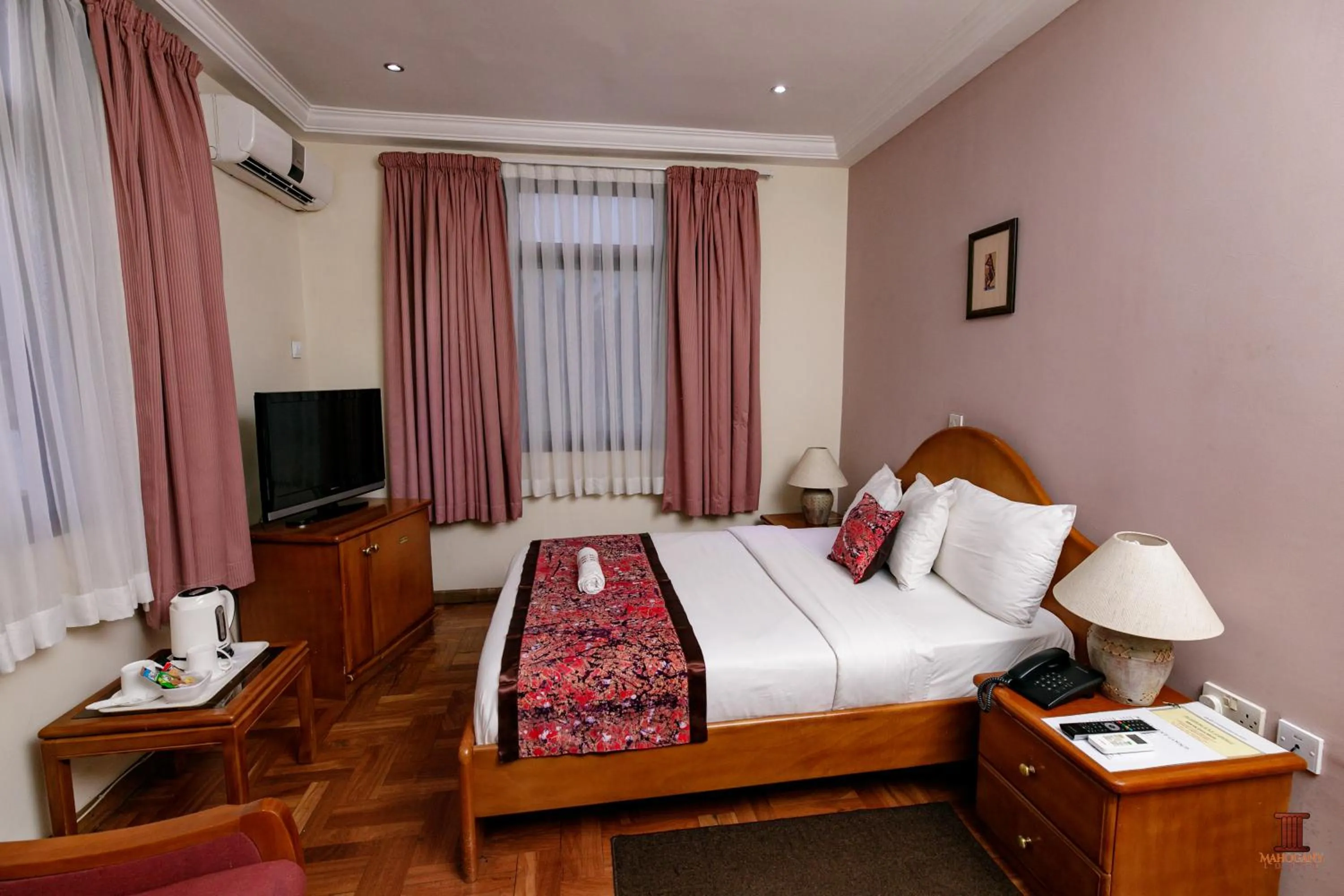Bed in Mahogany Lodge, Cantonments