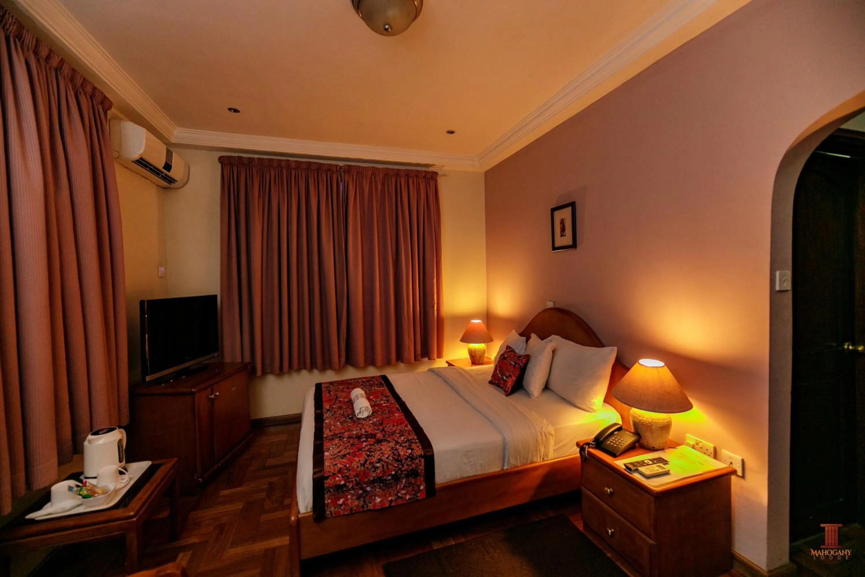 Bed in Mahogany Lodge, Cantonments