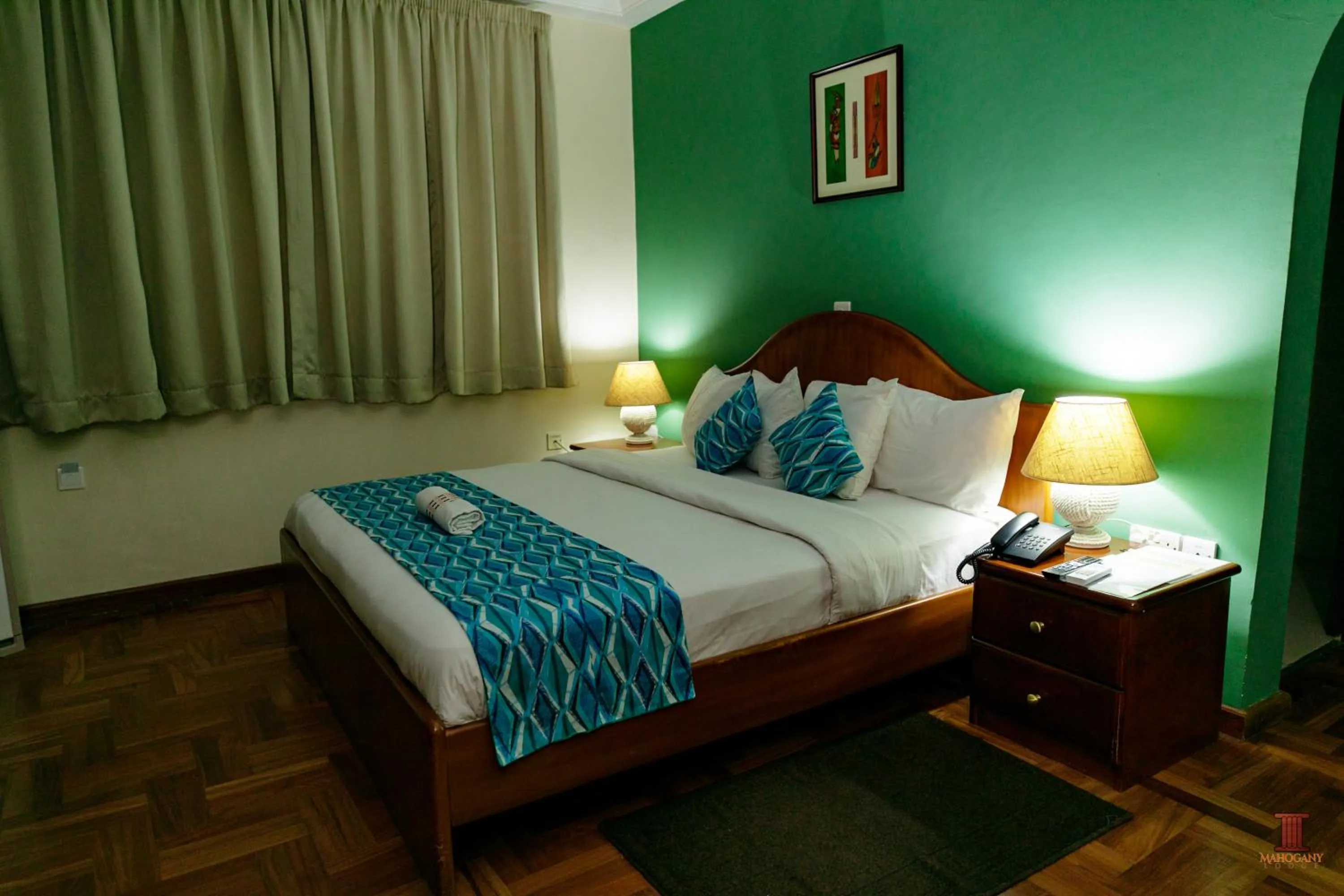 Bed in Mahogany Lodge, Cantonments