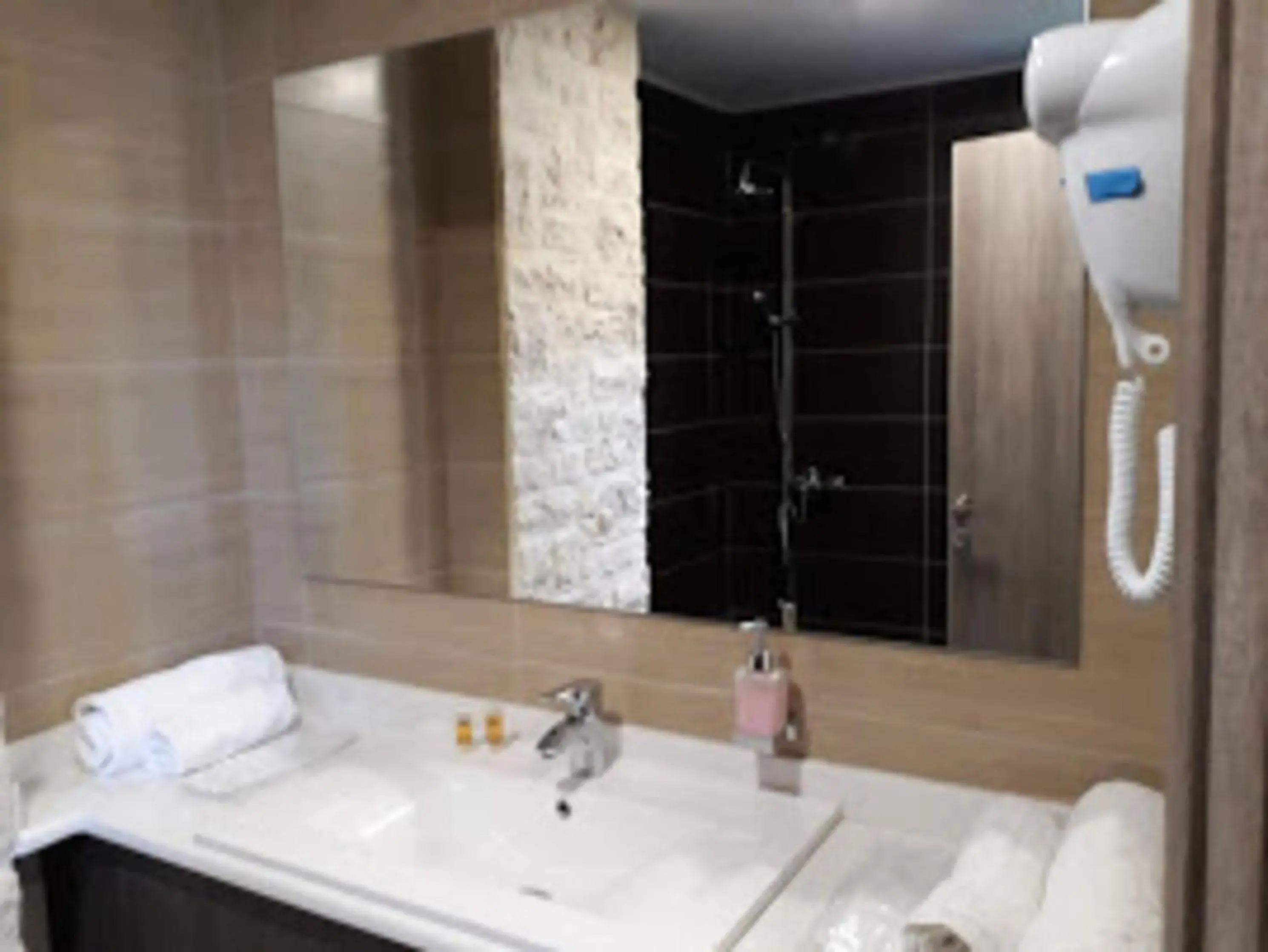 Bathroom in The Santo George Beach Resort Bathroom in The Santo George Beach Resort