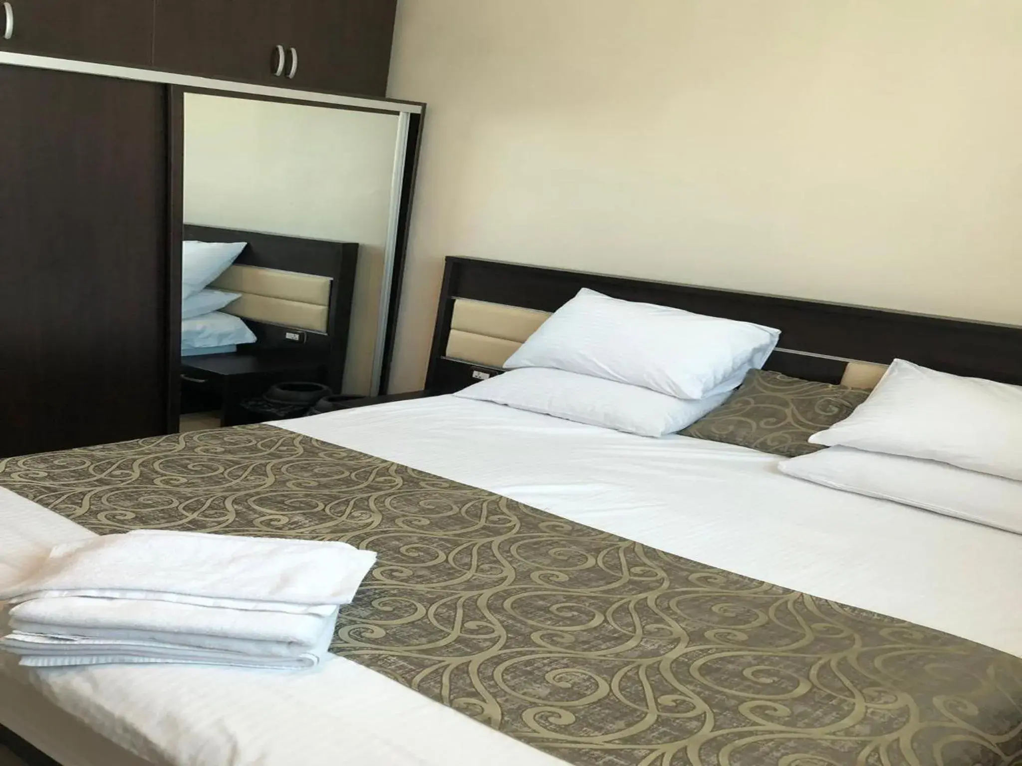 Bed in Panda Hotel Apartments Bed in Panda Hotel Apartments