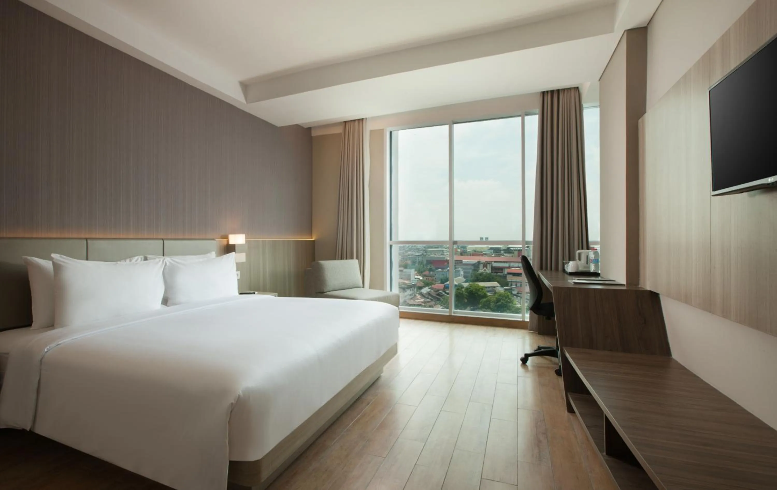 Photo of the whole room, Bed in Hotel Santika Radial Palembang