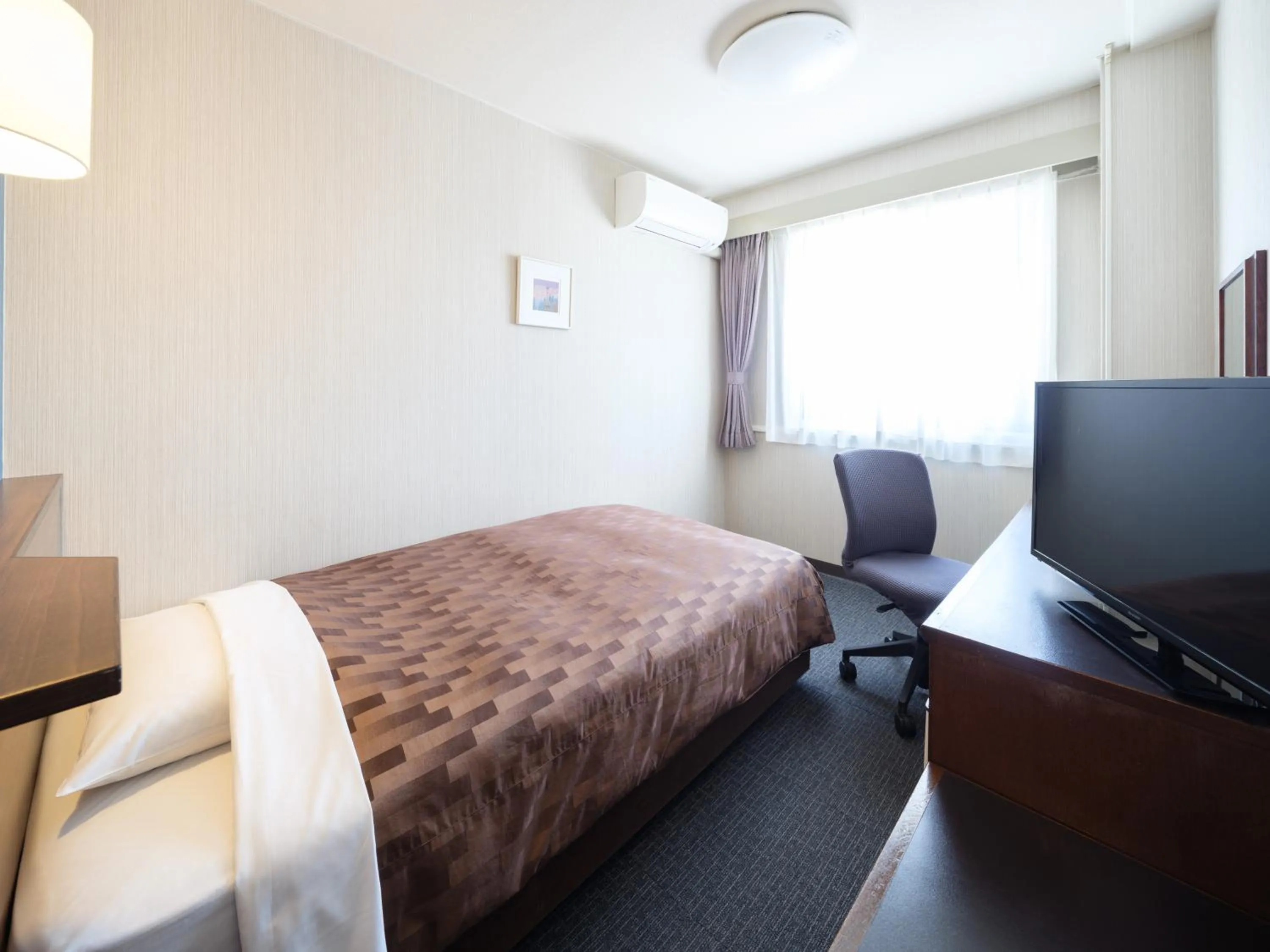 Bed in Yokaichi Royal Hotel