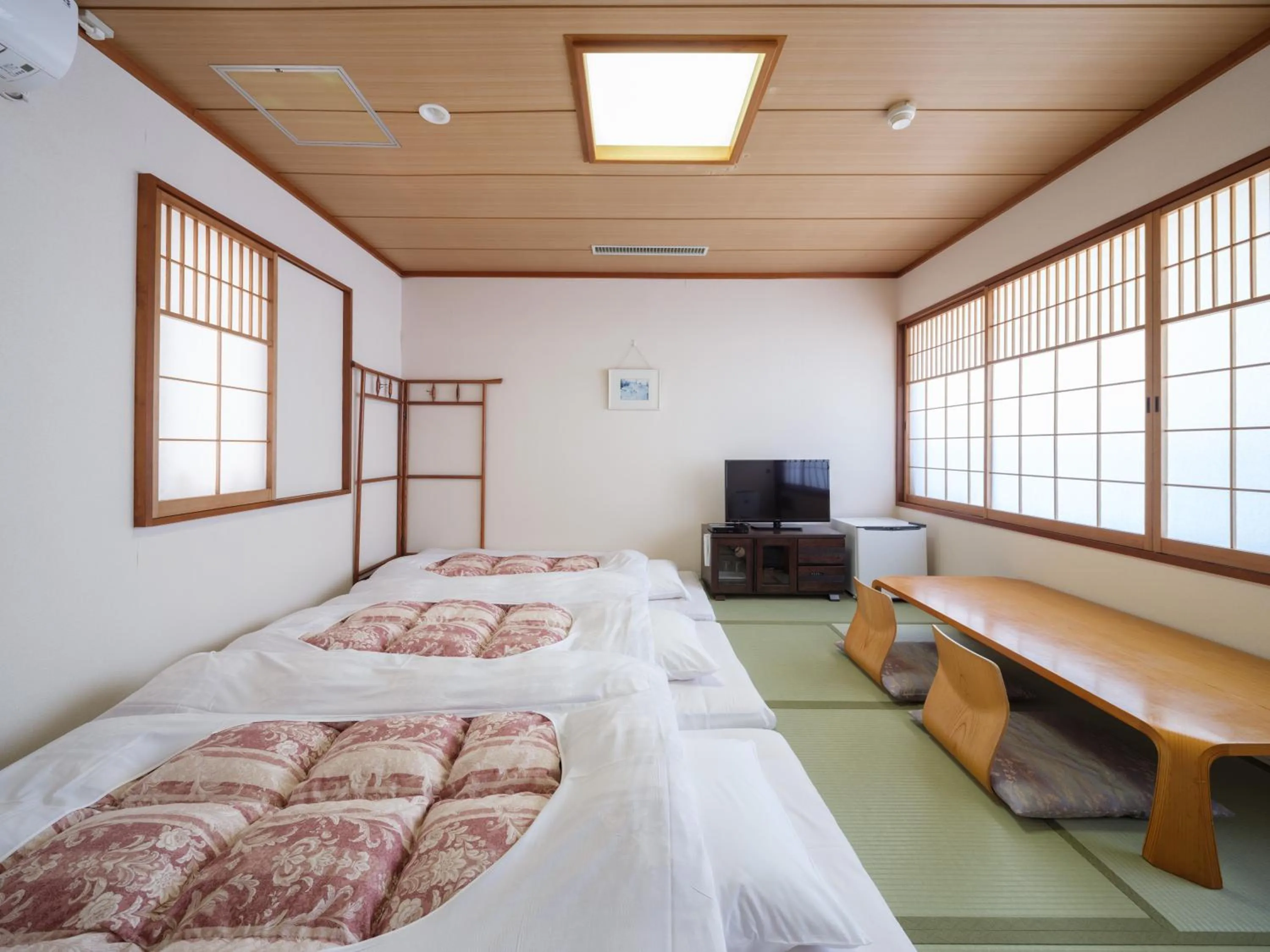 Bed in Yokaichi Royal Hotel