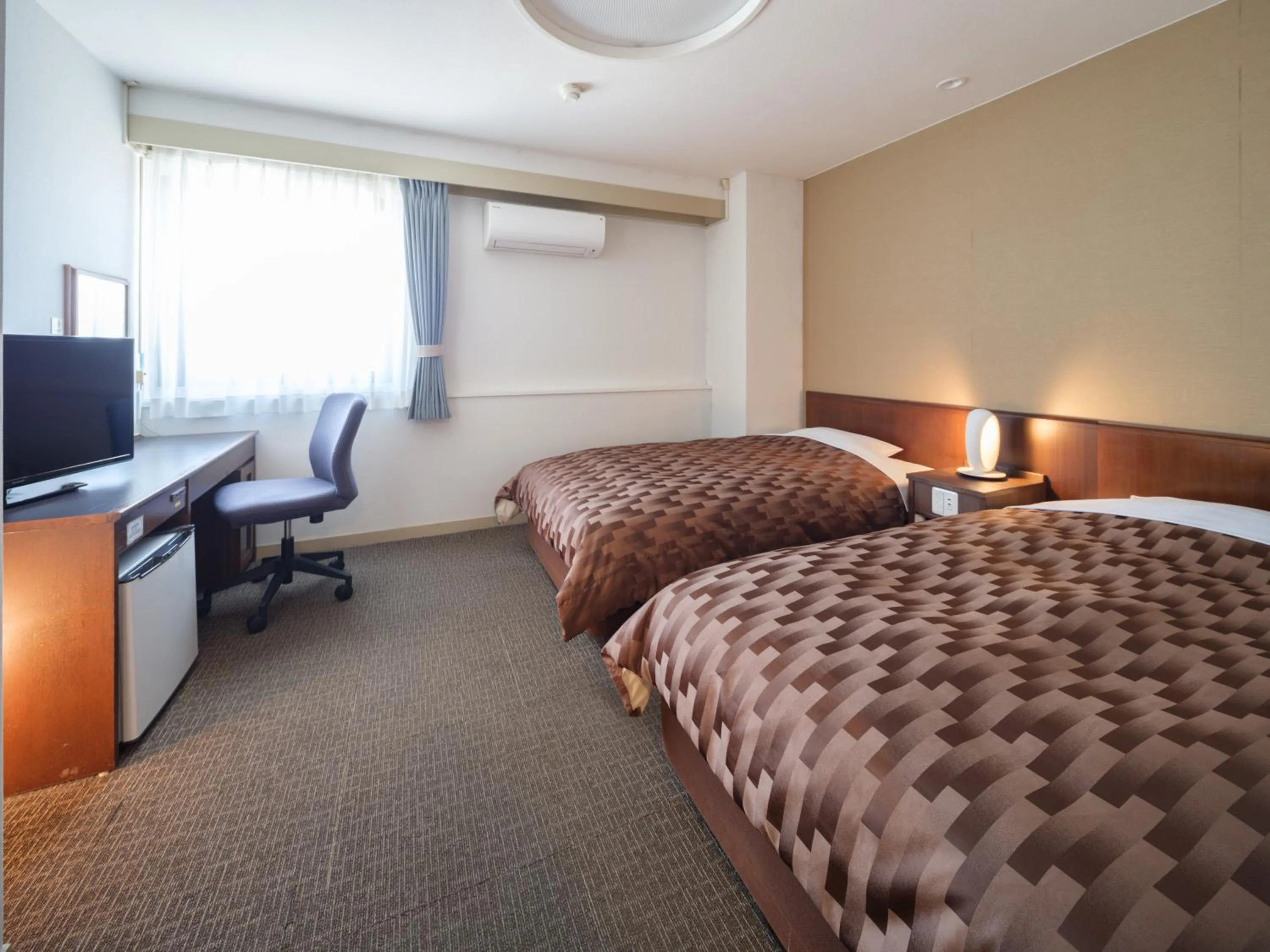 Bed in Yokaichi Royal Hotel