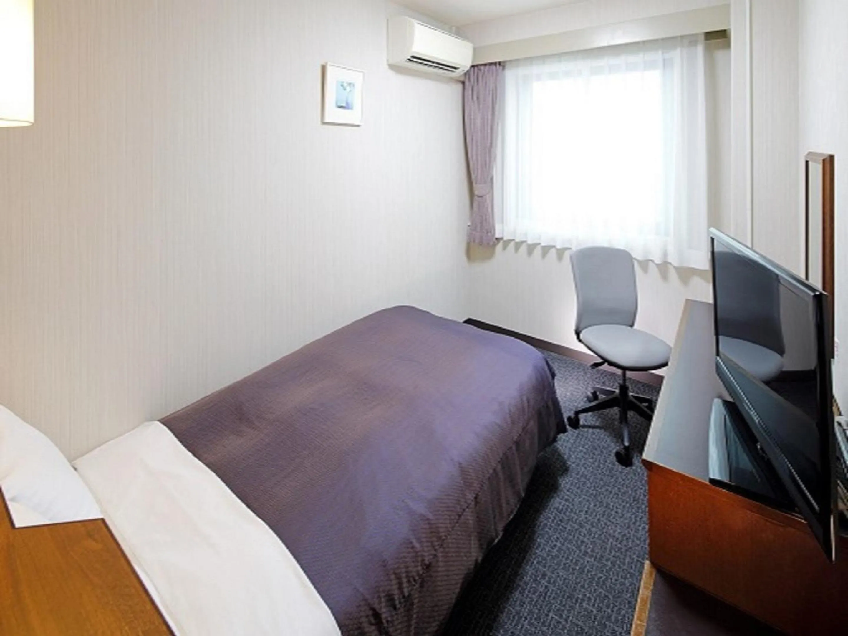 Bed in Yokaichi Royal Hotel