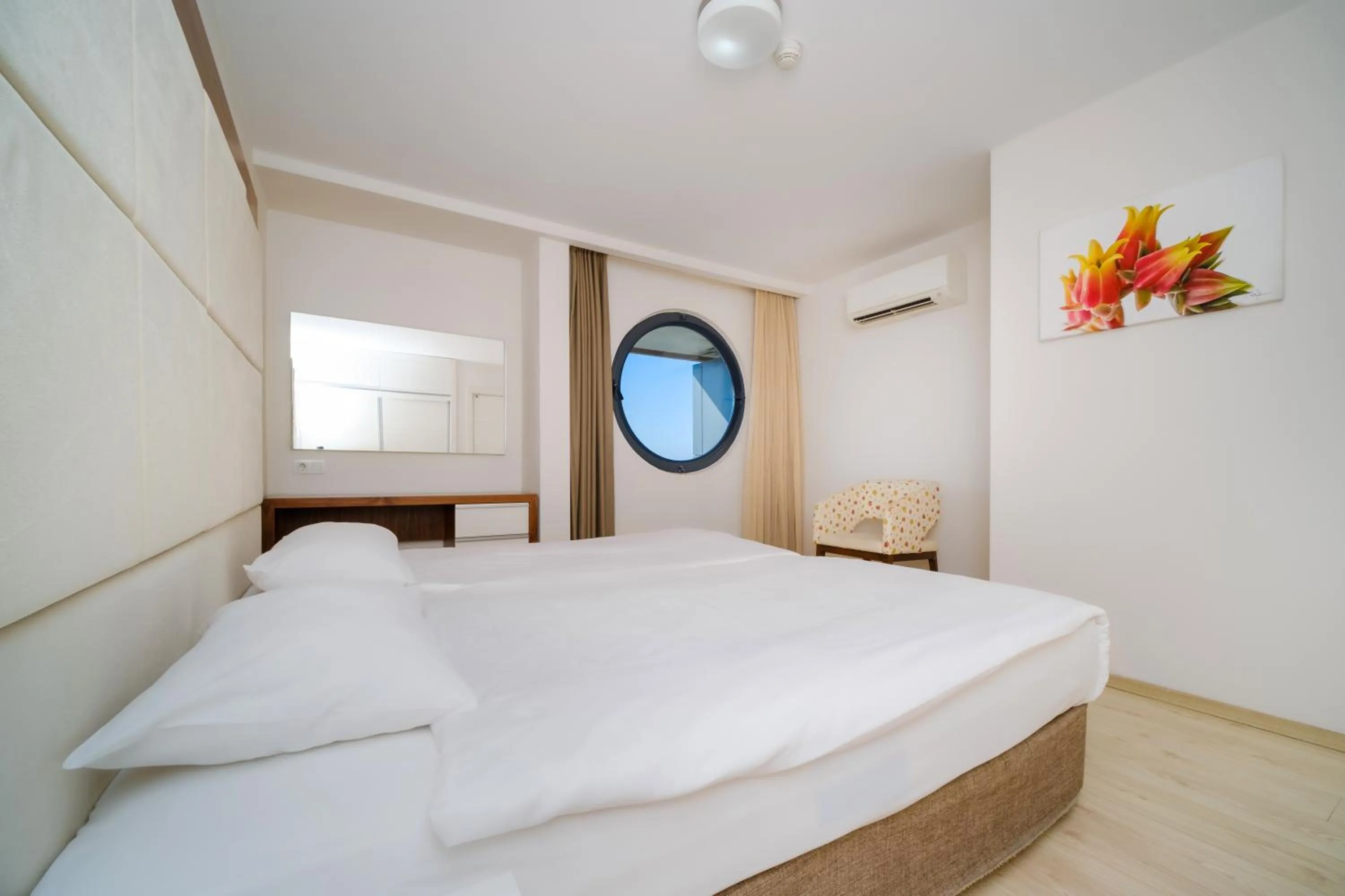 Bed in Delfino Apart Hotel